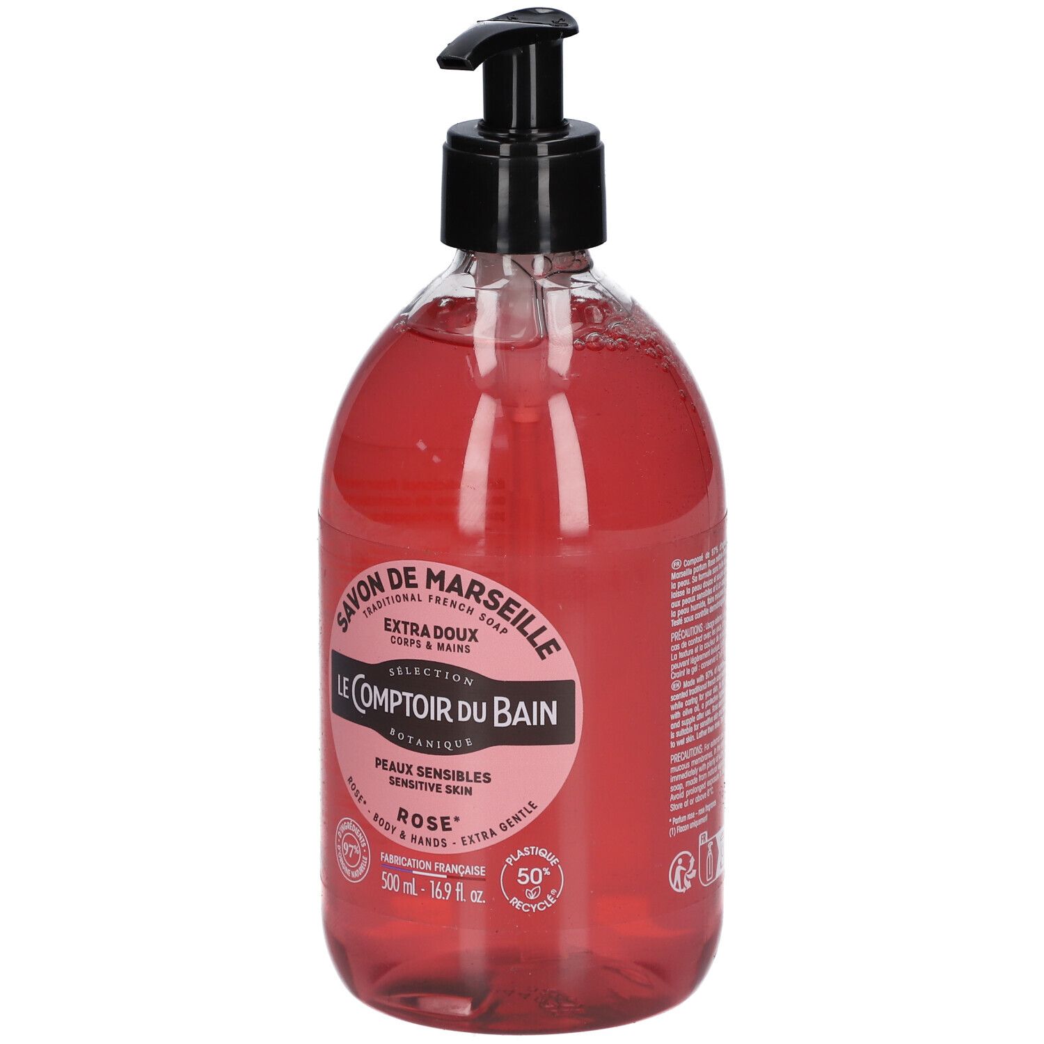 Flacon rond transparent, liquide rose, pompe noire. Inscriptions: Savon de Marseille, Le Comptoir du Bain, Rose. Pour peaux sensibles.