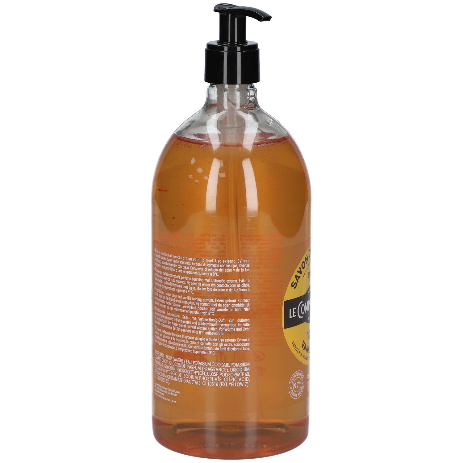 Dos d'un flacon transparent avec liquide brun. Étiquette avec texte et ingrédients. Pompe noire.
