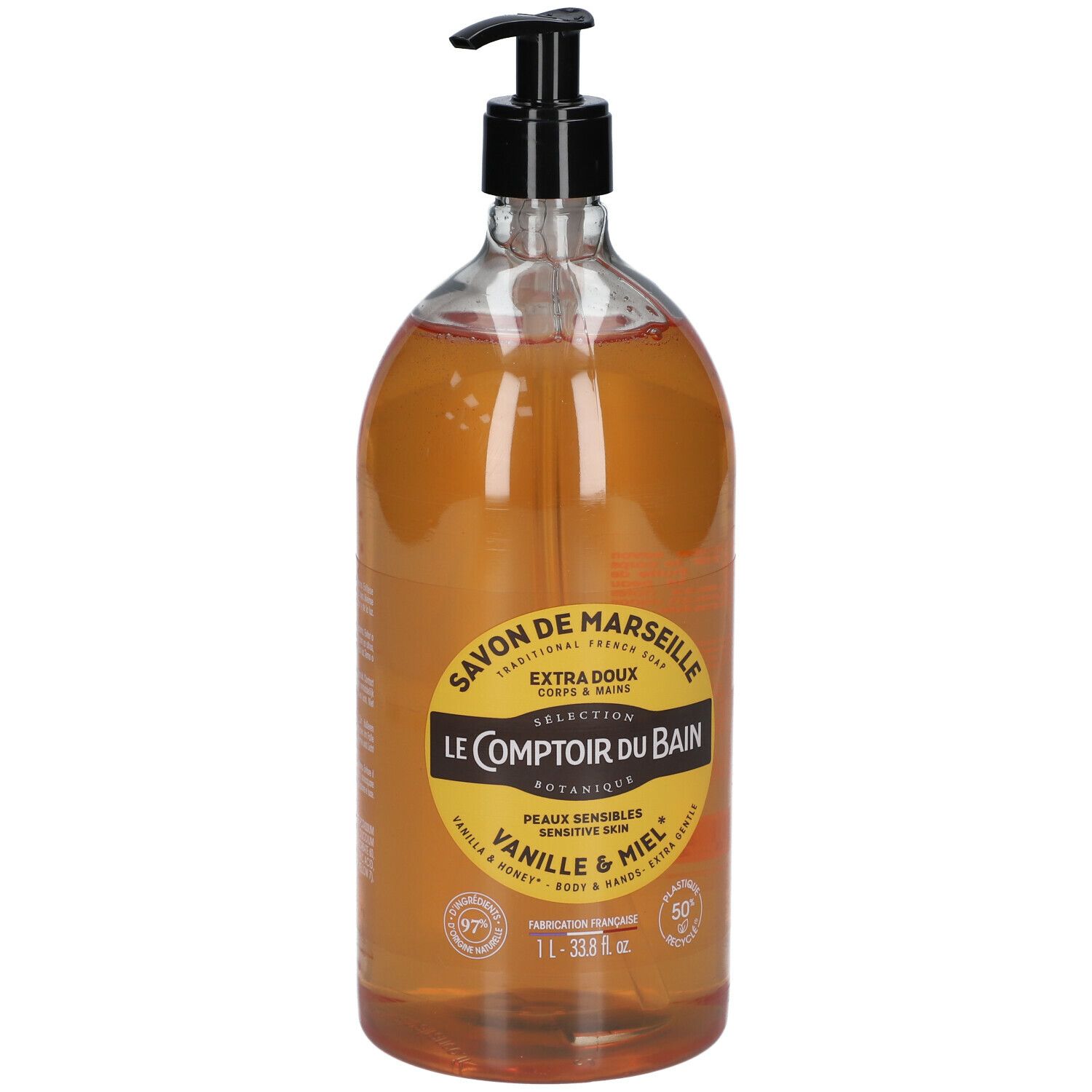 Flacon transparent avec liquide brun et pompe noire. Étiquette : Savon de Marseille, Vanille & Miel. 1L.