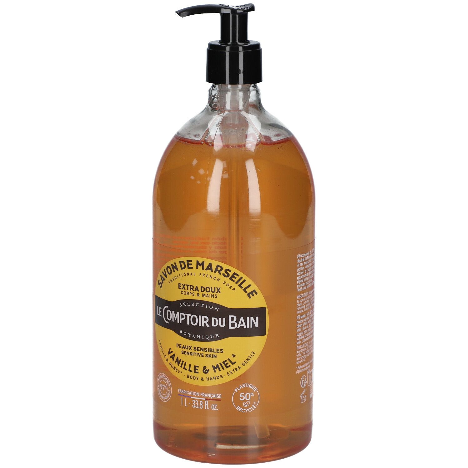 Flacon transparent avec liquide brun et pompe noire. Étiquette : Savon de Marseille, Vanille & Miel. 1L.