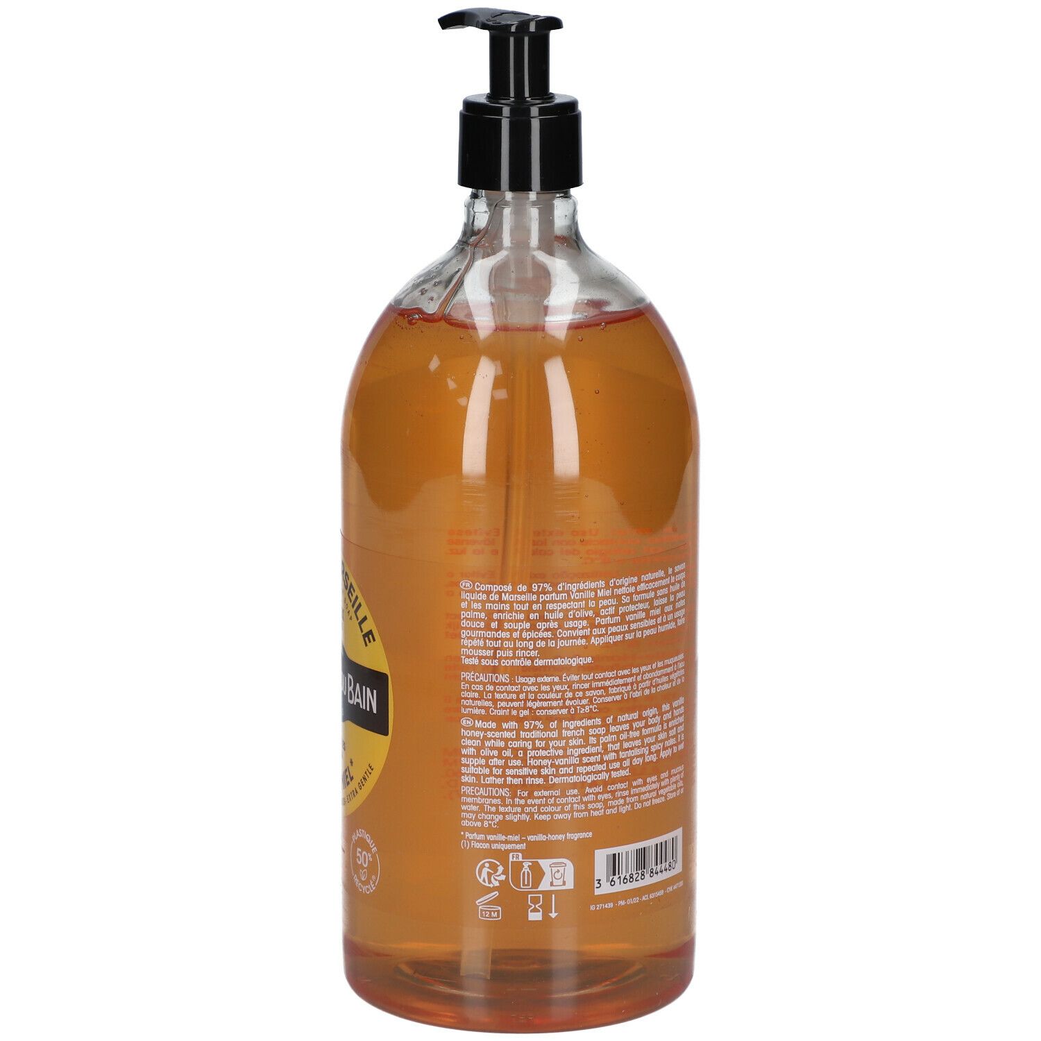 Dos d'un flacon transparent avec liquide brun. Étiquette avec texte et ingrédients. Pompe noire.