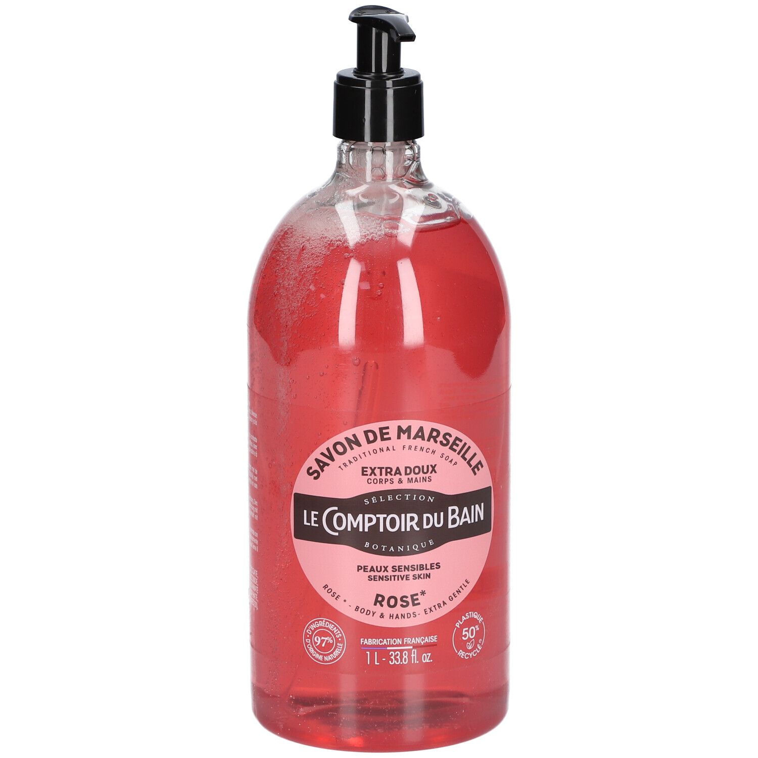 Flacon transparent de savon liquide rose avec pompe noire. Étiquette avec informations produit.