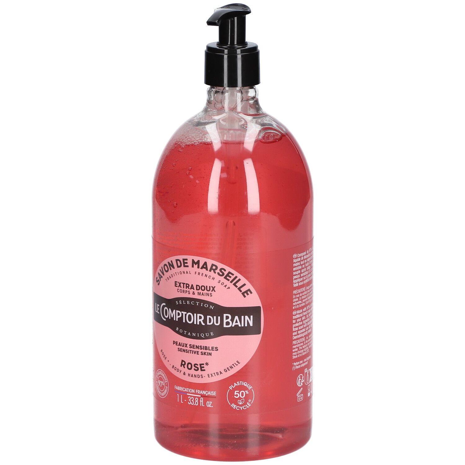 Flacon transparent de savon liquide rose avec pompe noire. Étiquette avec informations produit.