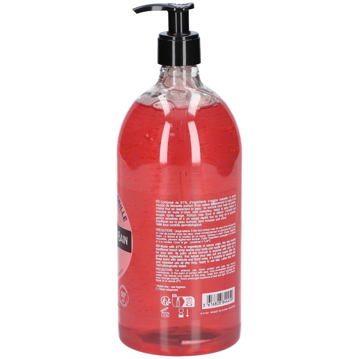 Dos du flacon transparent de savon liquide rose. Pompe noire. Texte sur l'étiquette.