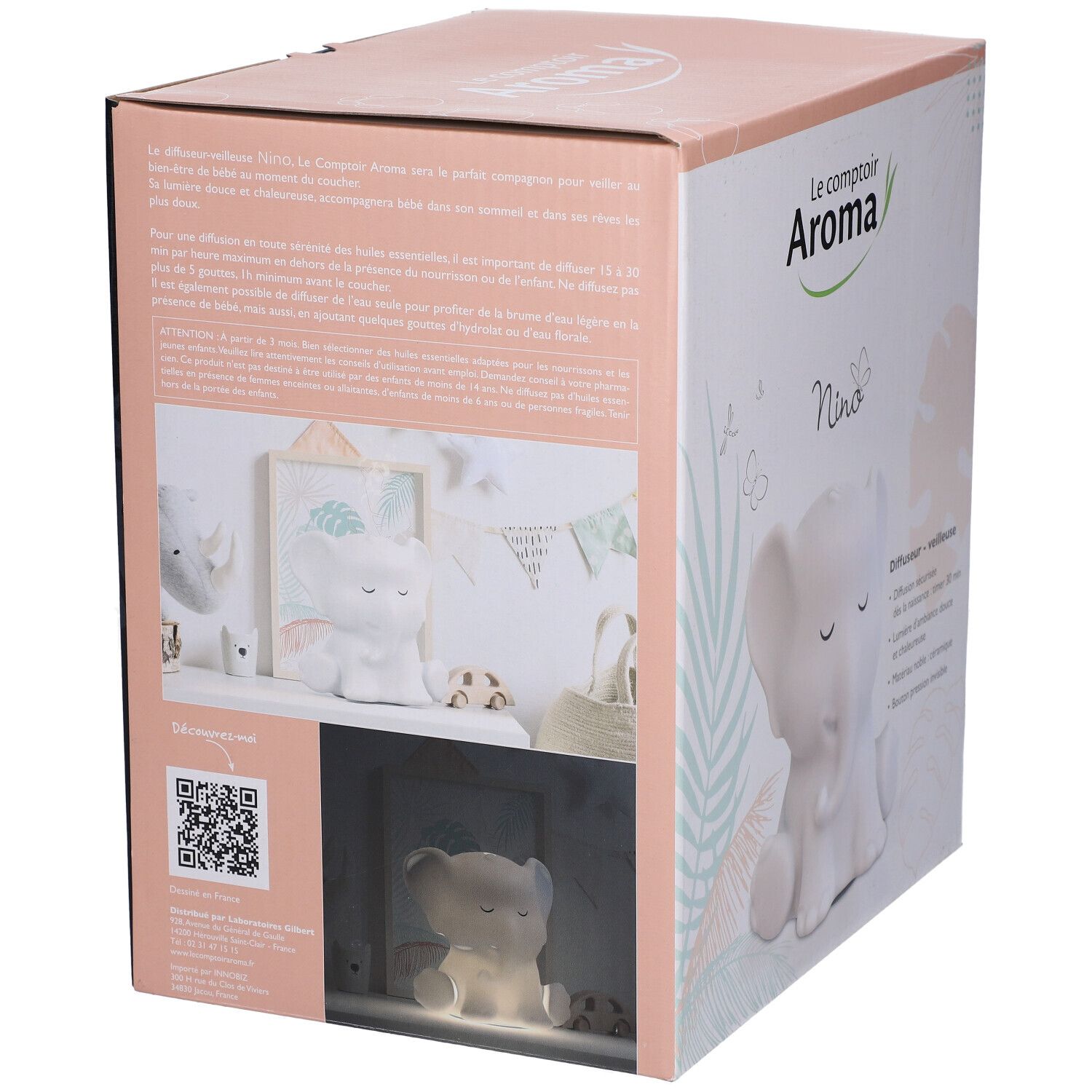 Boîte du diffuseur veilleuse NINO. Rose et blanc. Image du produit. Logo: Le comptoir Aroma. Forme d'éléphant.