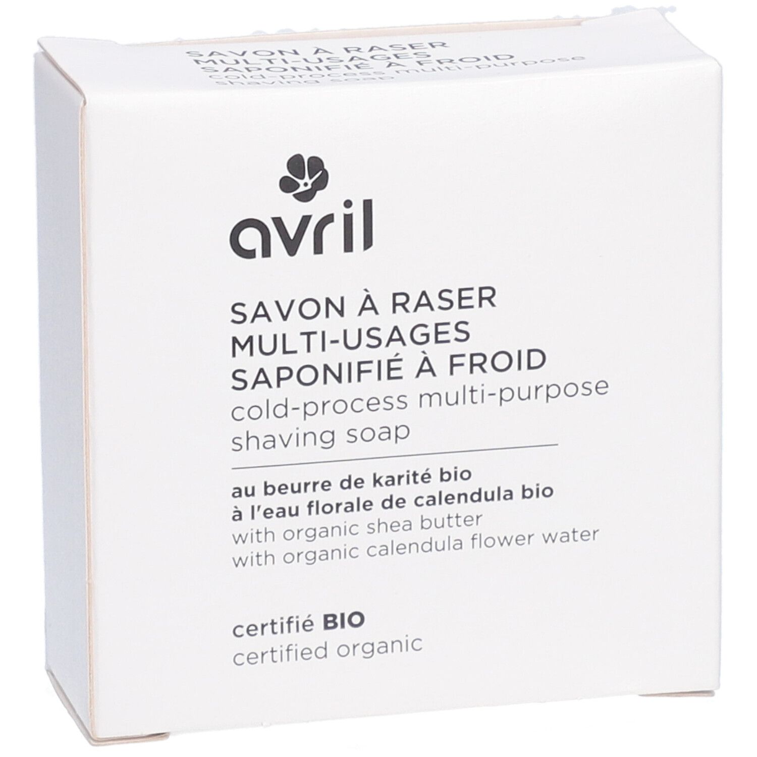 Witte kartonnen verpakking, schuin. Opschrift: avril, Savon à raser multi-usages, saponifié à froid, cold-process multi-purpose shaving soap. Bio-certificering.