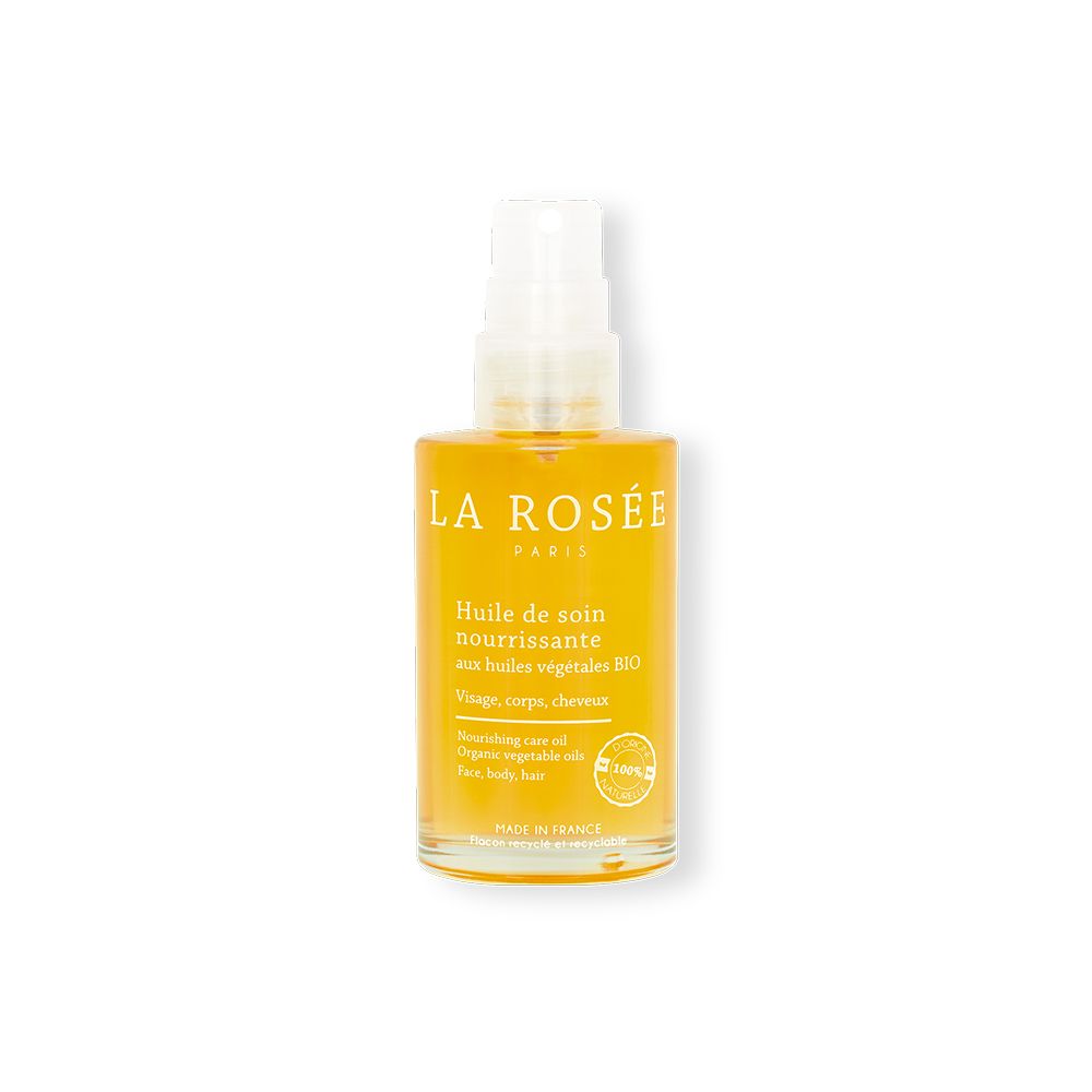 Flacon jaune avec pompe. Inscription : LA ROSÉE, Huile de soin nourrissante. Certification BIO.