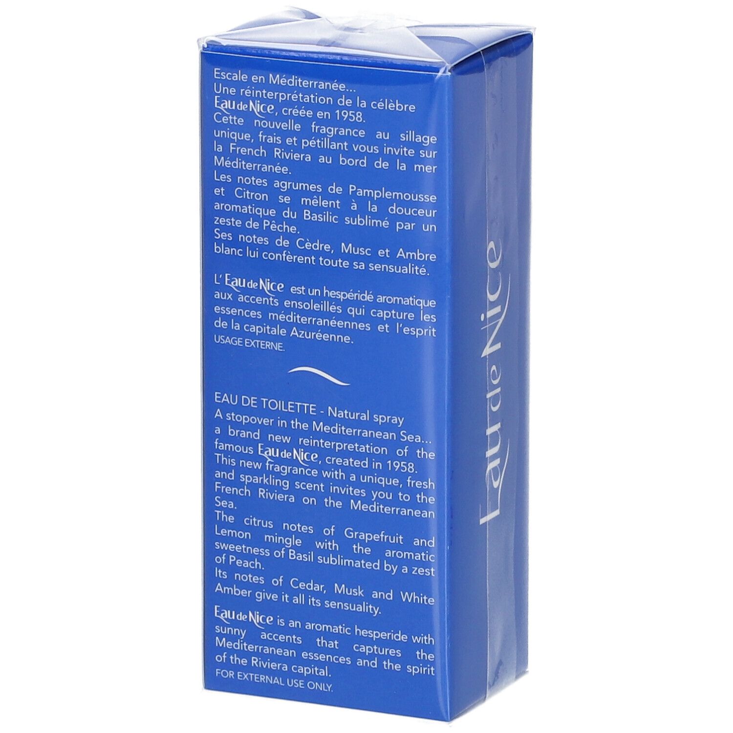 Blauwe doos met tekst. Op de zijkant: "Eau de Nice". Verpakt in transparant plastic. Meertalige tekst.