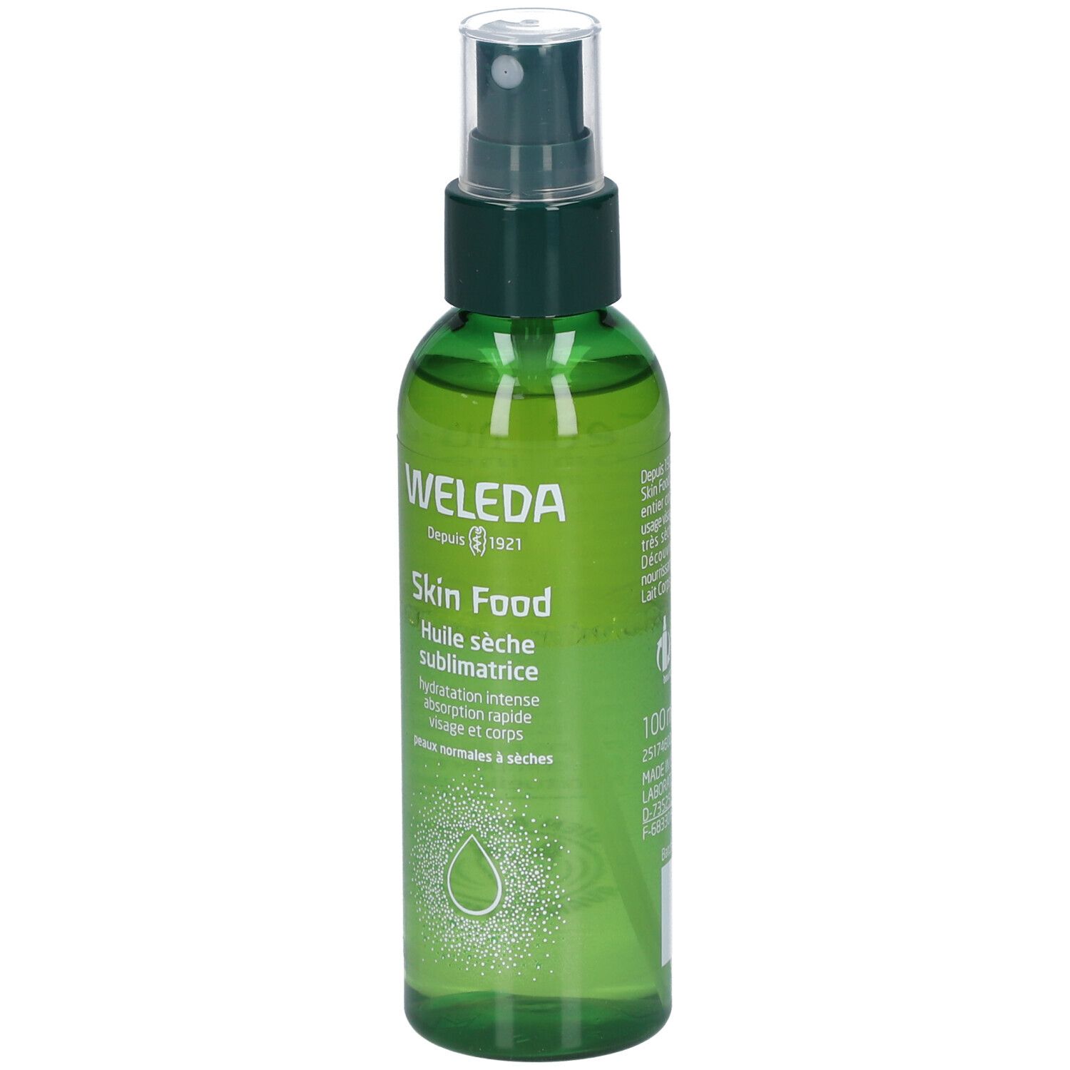 Grüne Sprühflasche mit WELEDA Skin Food. Klare Flüssigkeit, grüner Deckel. Text: Huile sèche sublimatrice.