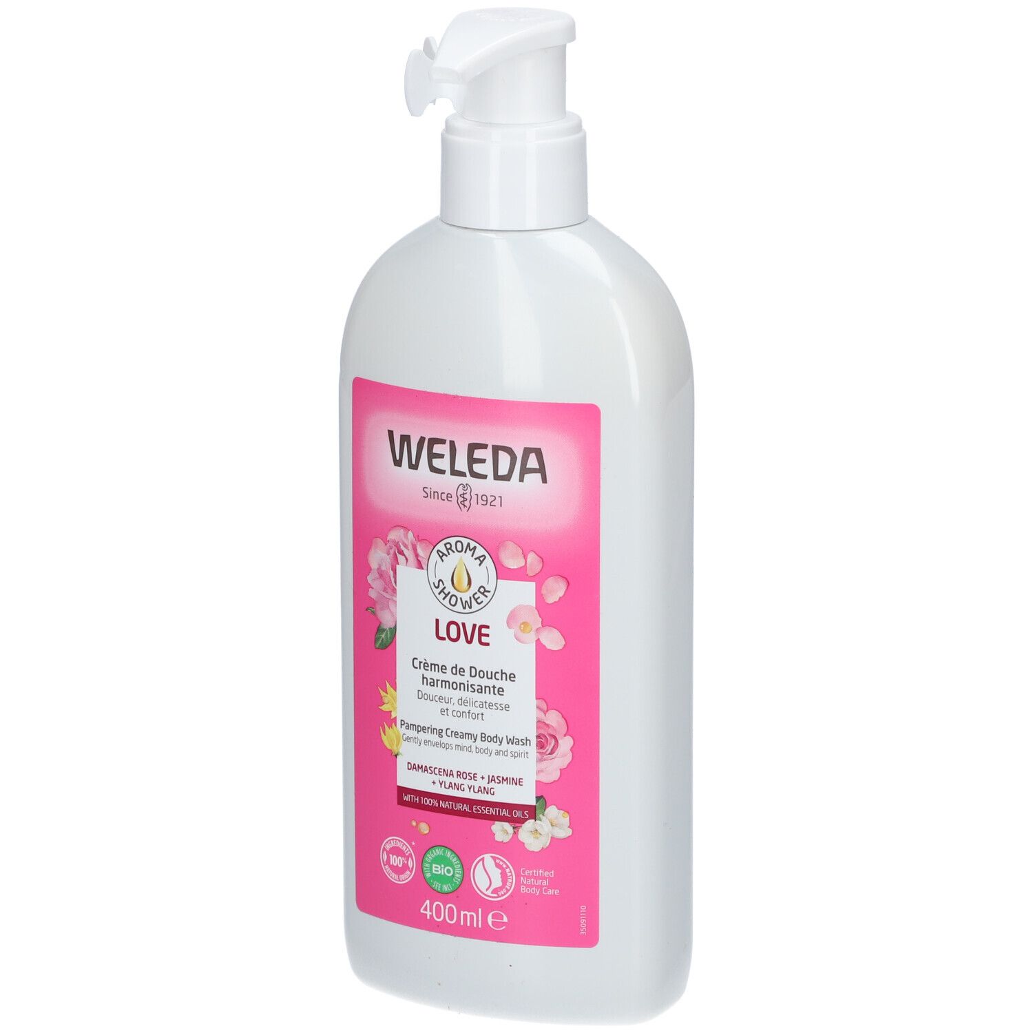 Flacon blanc avec pompe. Étiquette rose avec logo WELEDA, nom LOVE et illustrations florales. Contenance 400ml.