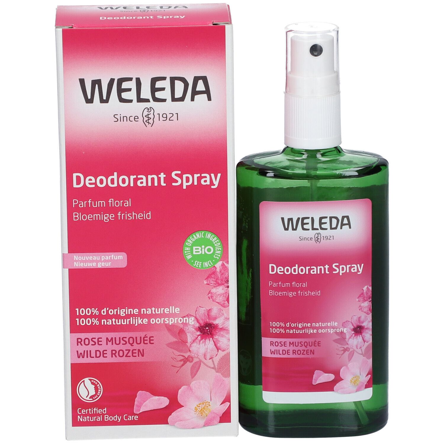 Produktflasche und Verpackung. Grüne Flasche mit weißem Sprühkopf. Verpackung mit Produktnamen und Rosenabbildung. Marke: Weleda.