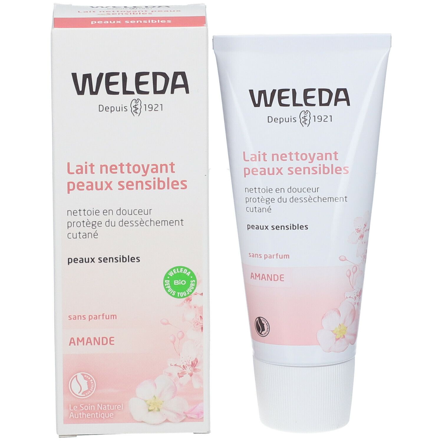 Produkt und Verpackung. Weiße Tube und Karton mit Produkttext und floralem Design. Schriftzug: WELEDA, Lait nettoyant peaux sensibles.