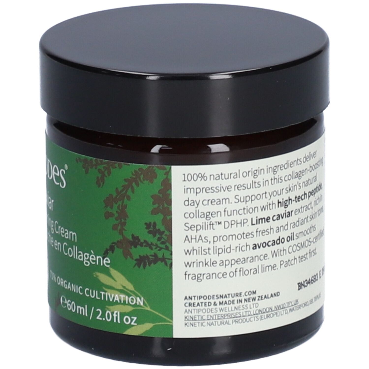 Creme-Dose mit grünem Etikett. Produktname, Bio-Siegel und Text. Braunes Glas, schwarzer Deckel.