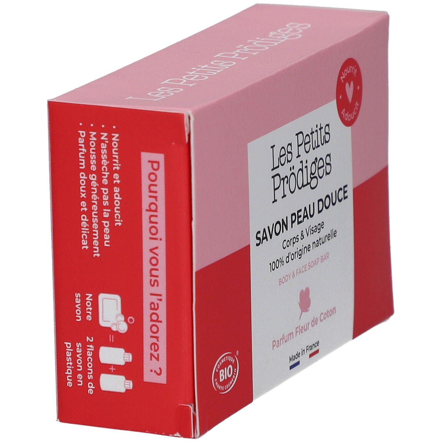 Boîte rose et rouge. Texte: SAVON PEAU DOUCE, 100% d'origine naturelle. Inscription: Pourquoi vous l'adorez? Certification BIO.