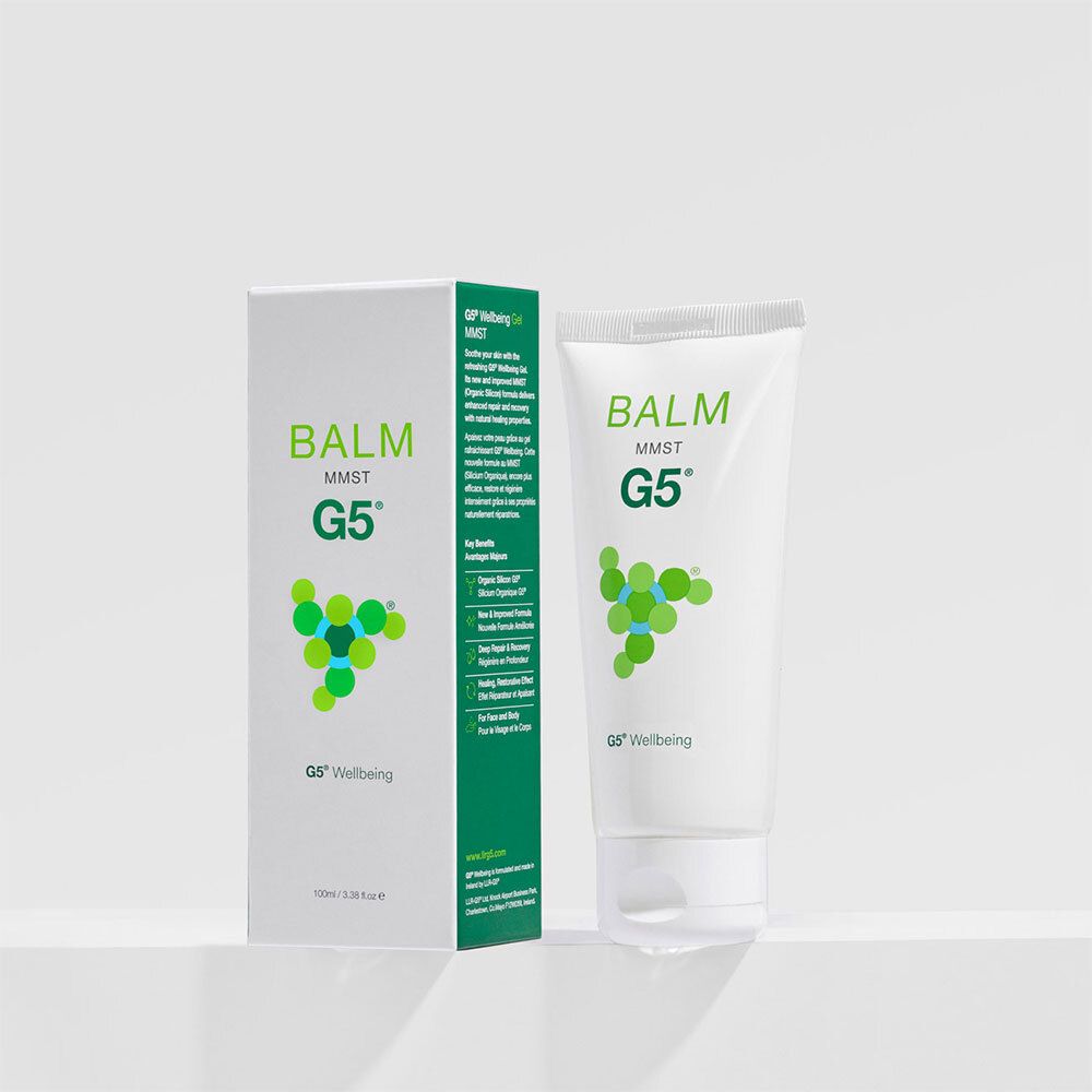 Weiße Tube und Schachtel mit grüner Schrift. Auf der Tube steht "BALM MMST G5". Die Schachtel zeigt das gleiche Design.