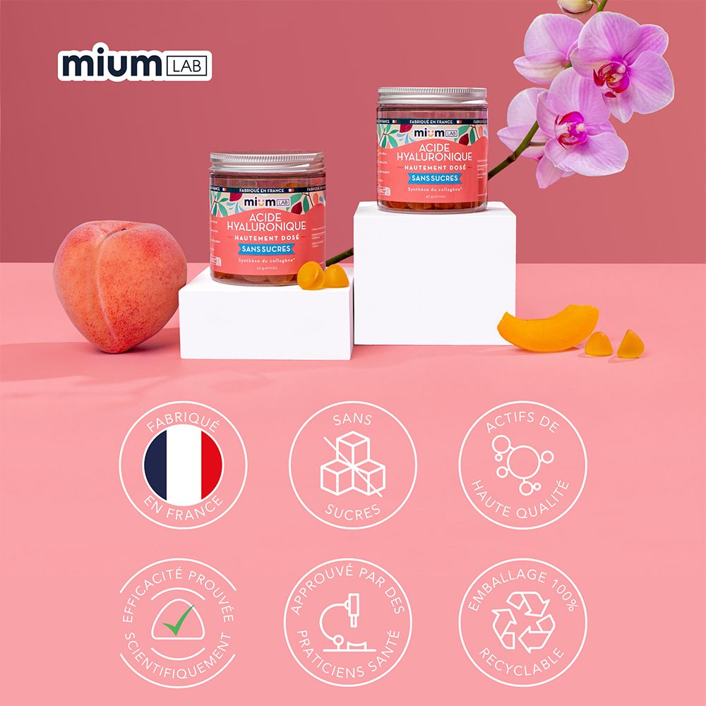 Deux pots de gummies, pêche, fleurs. Inscription: Fabriqué en France, Sans Sucres, Actifs de haute qualité.