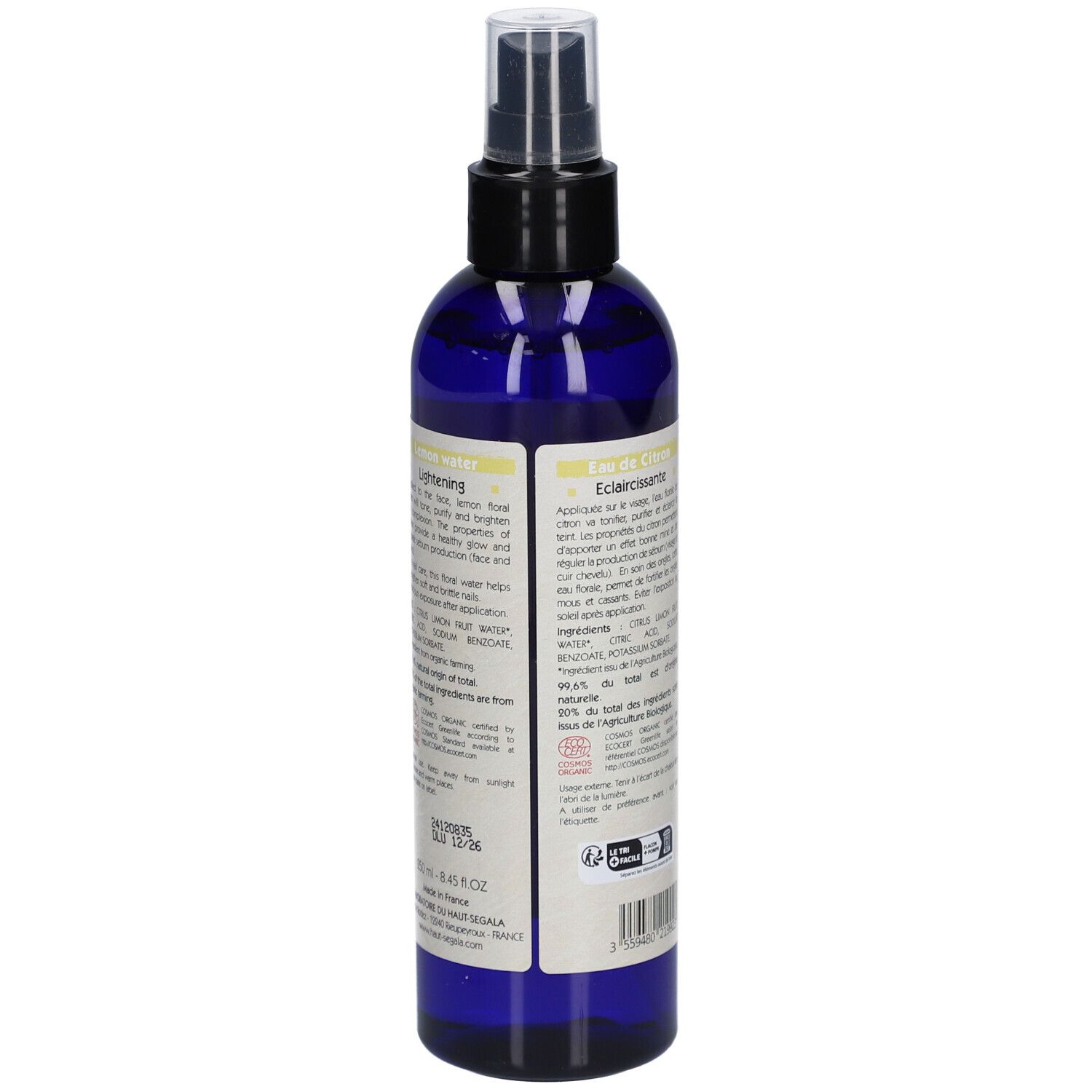 Blaue Flasche mit Zerstäuber. Aufkleber mit Zitrone, Text: Eau florale Citron, Lemon water, Eclaircissante/Lightening, Bio.