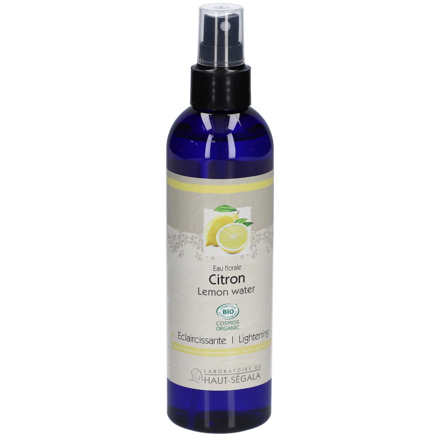 Blaue Flasche mit Zerstäuber. Aufkleber mit Zitrone, Text: Eau florale Citron, Lemon water, Eclaircissante/Lightening, Bio.