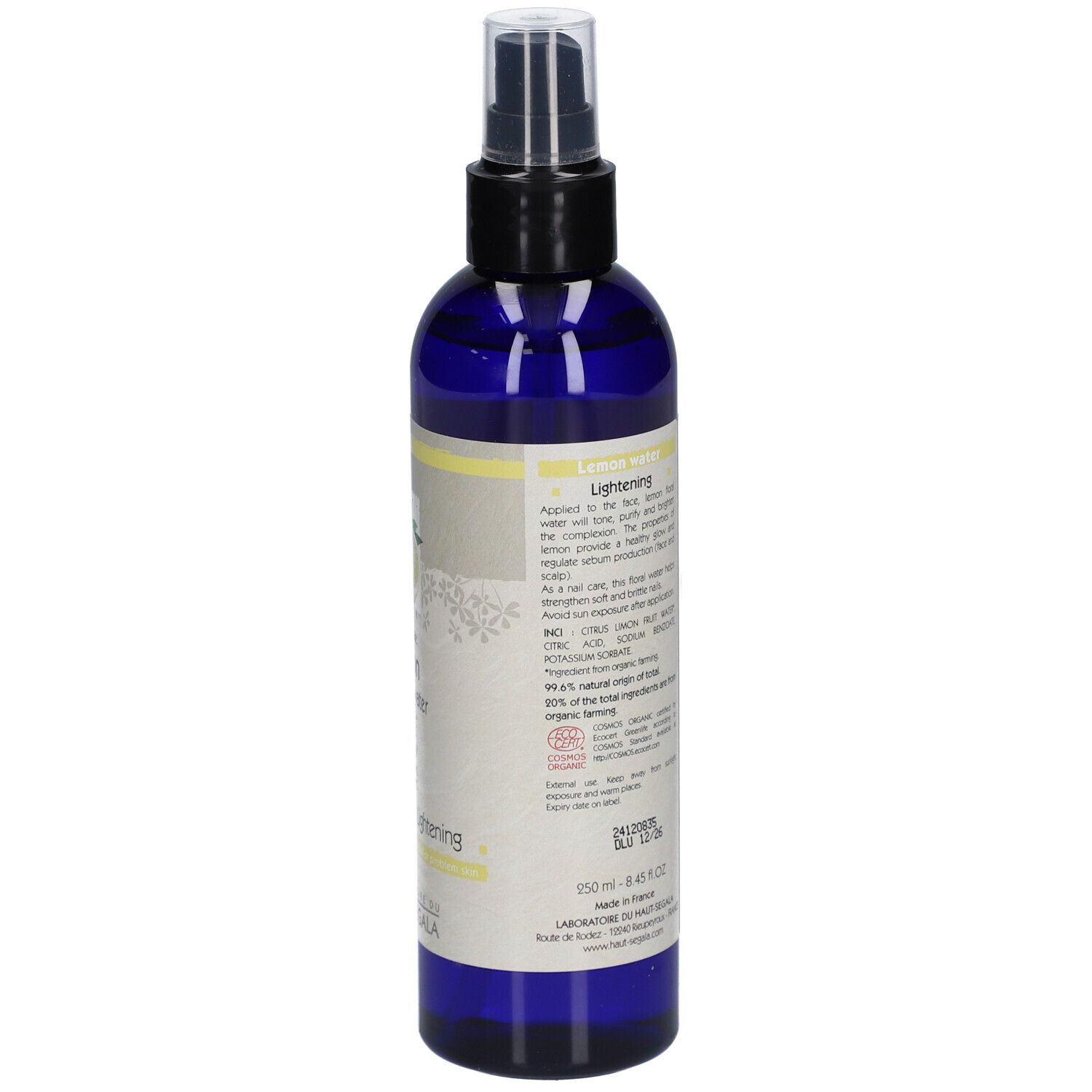 Blaue Flasche mit Zerstäuber. Aufkleber mit Zitrone, Text, Inhaltsstoffe, Eclaircissante/Lightening, Bio-Zertifizierung.