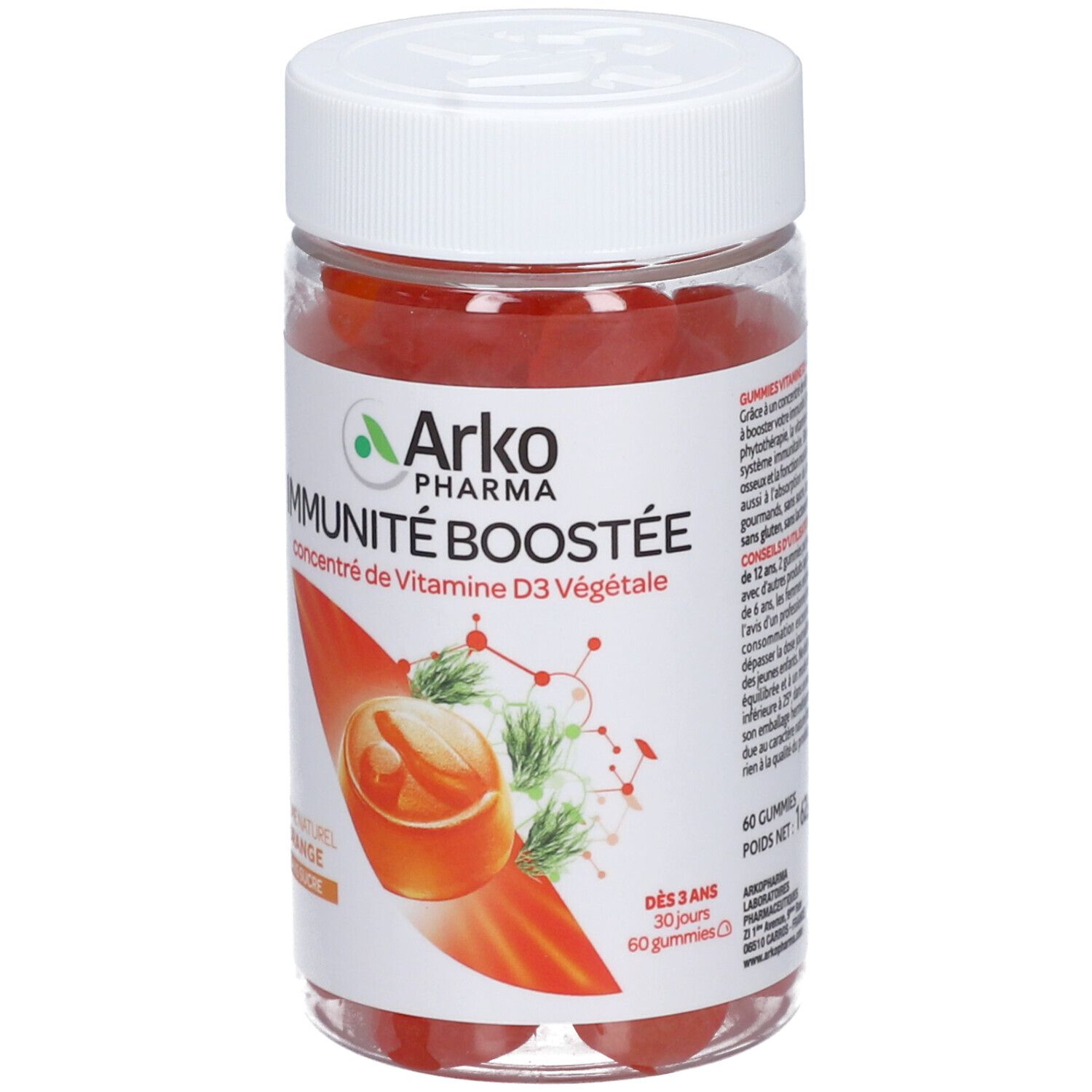Boîte plastique transparente avec bonbons gélifiés rouges. Étiquette "Arko Pharma IMMUNITÉ BOOSTÉE" et illustrations. Couvercle blanc.