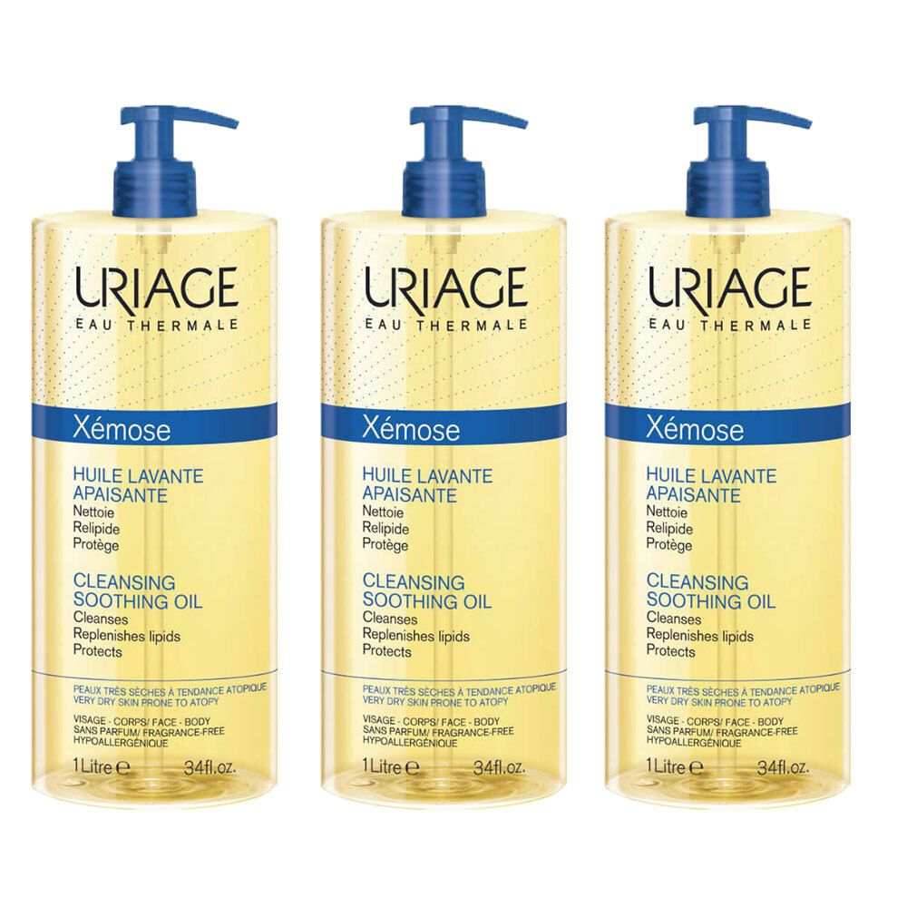 Trois flacons d'huile lavante Uriage Xemose. Chaque flacon a une pompe bleue et un liquide jaune. Texte : "Huile Lavante Apaisante".