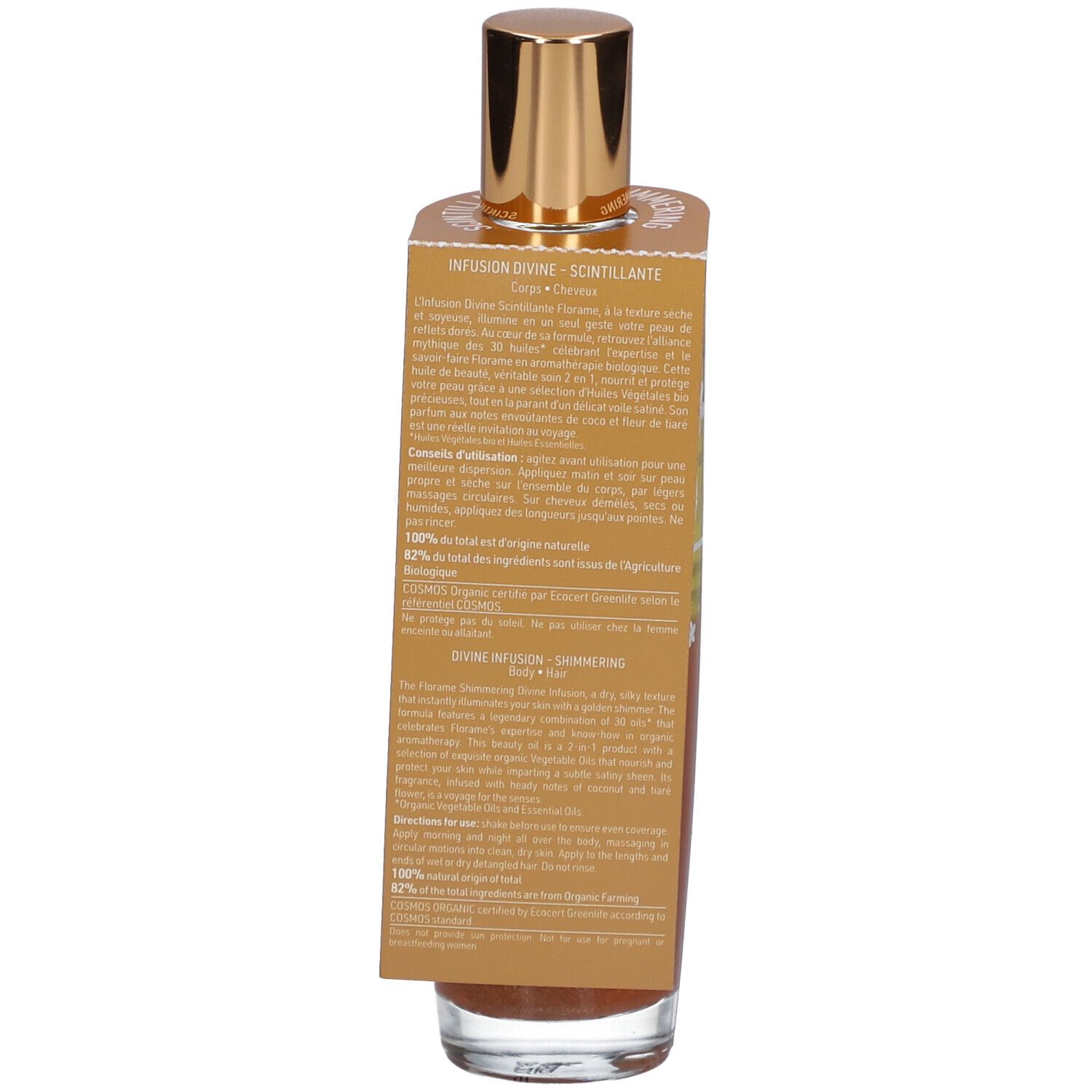 Flacon en verre avec bouchon doré. Étiquette avec informations sur le produit. Liquide aux tons or et bronze.