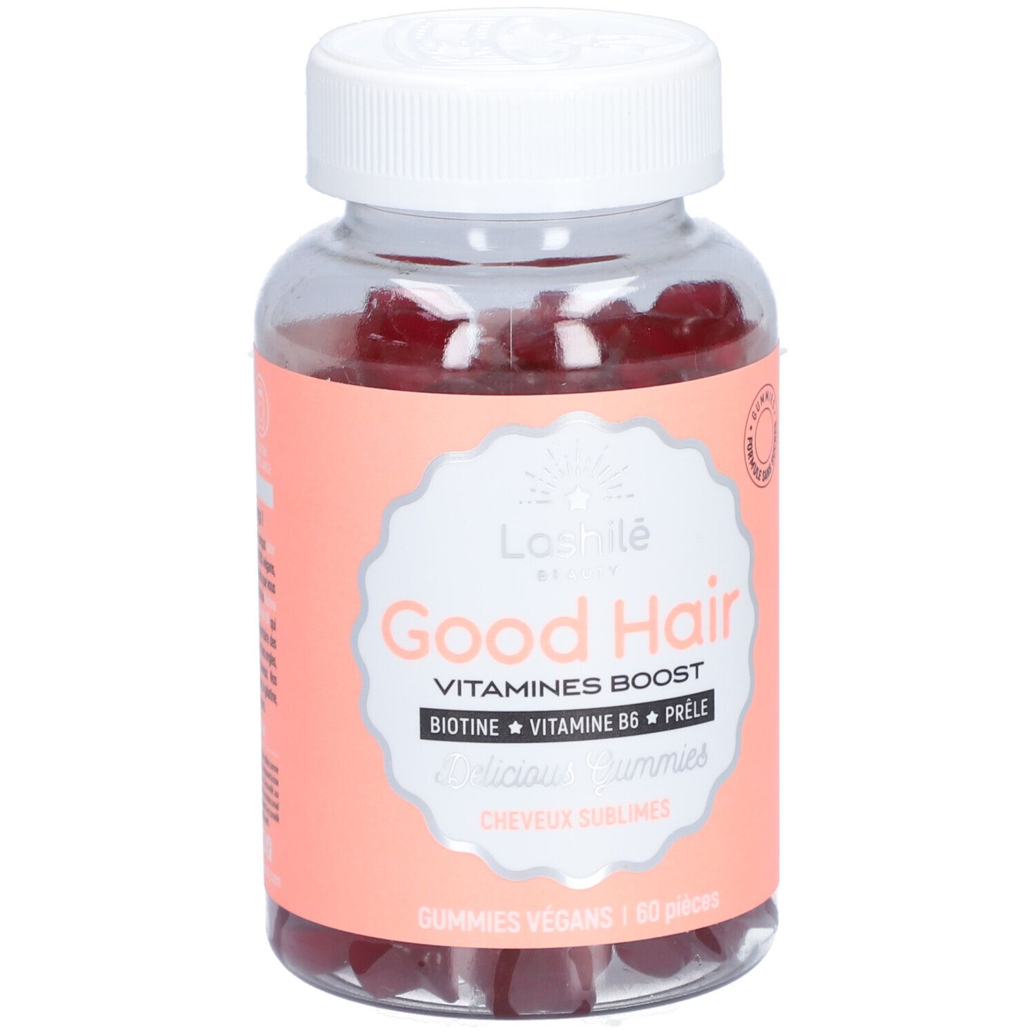 Flacon transparent avec gummies rouges. Étiquette "Good Hair" et ingrédients. Bouchon blanc.