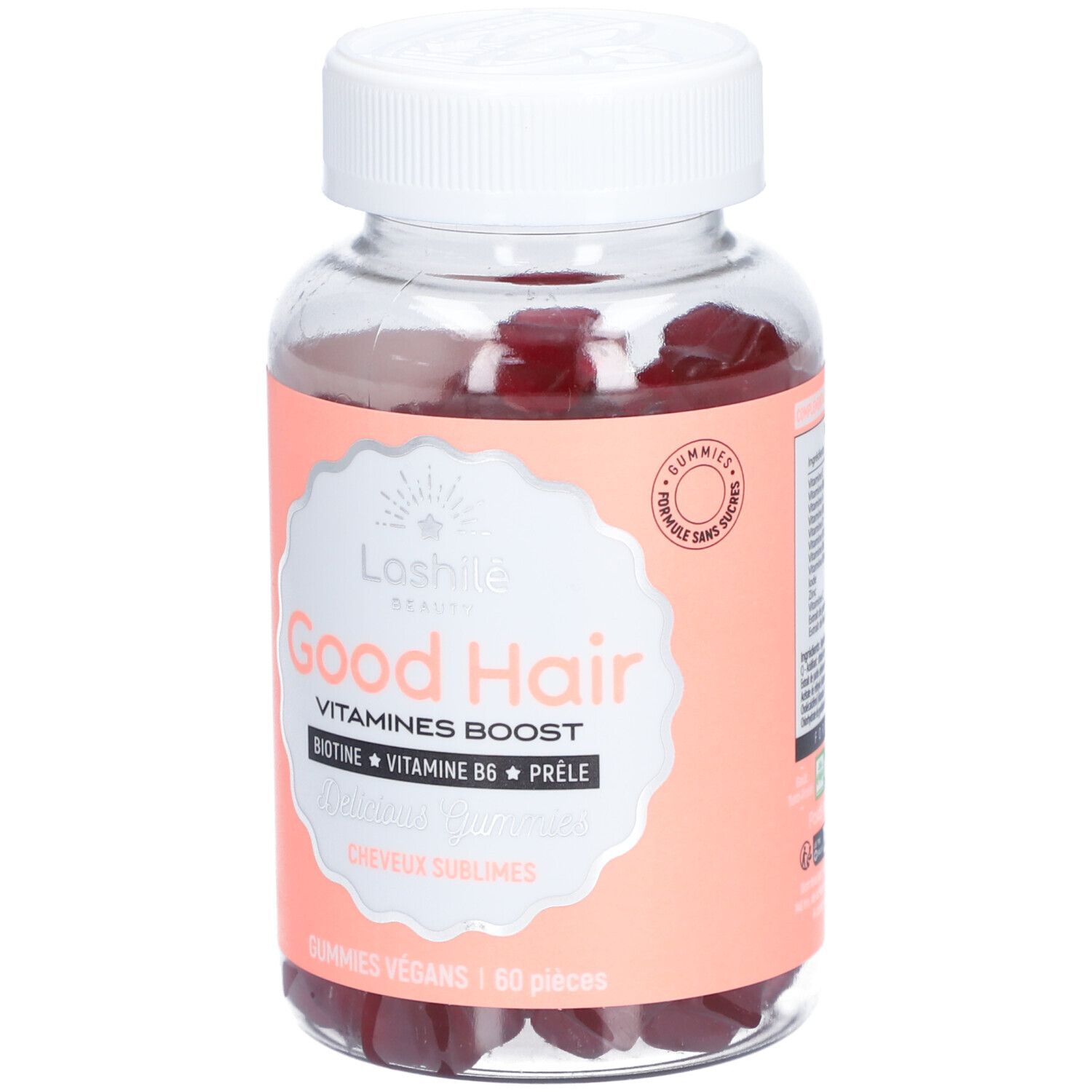 Flacon transparent avec gummies rouges. Étiquette "Good Hair" et ingrédients. Bouchon blanc.