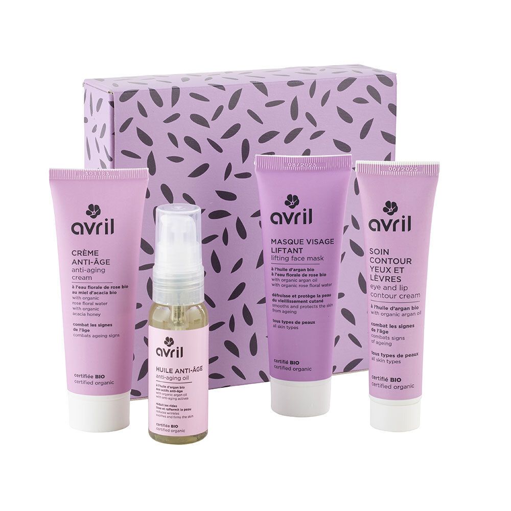 Geschenkset met vier cosmetica en een flesje. Producten in paarse tubes en flesje, in een paarse doos.