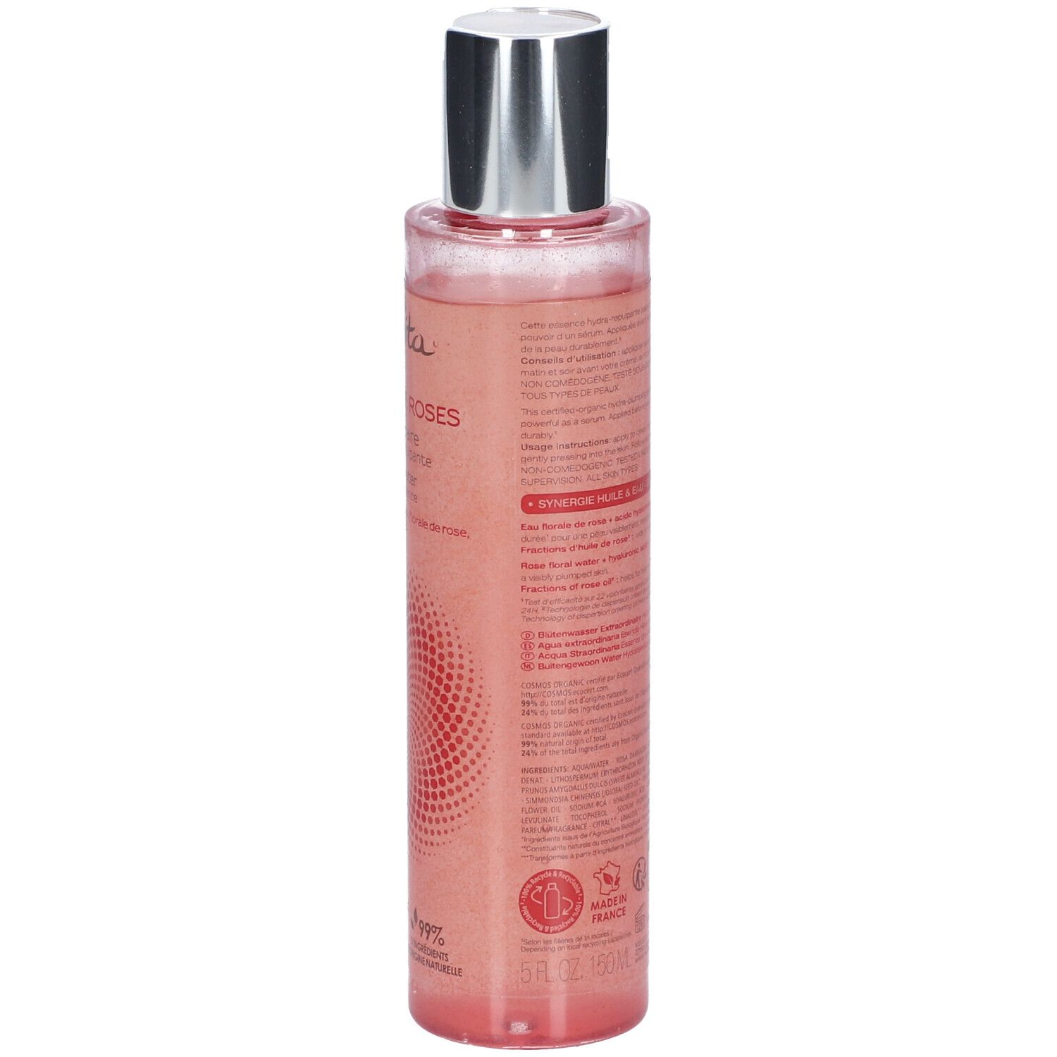 Dos d'un flacon transparent, liquide rose. Bouchon argenté. Texte sur l'étiquette.