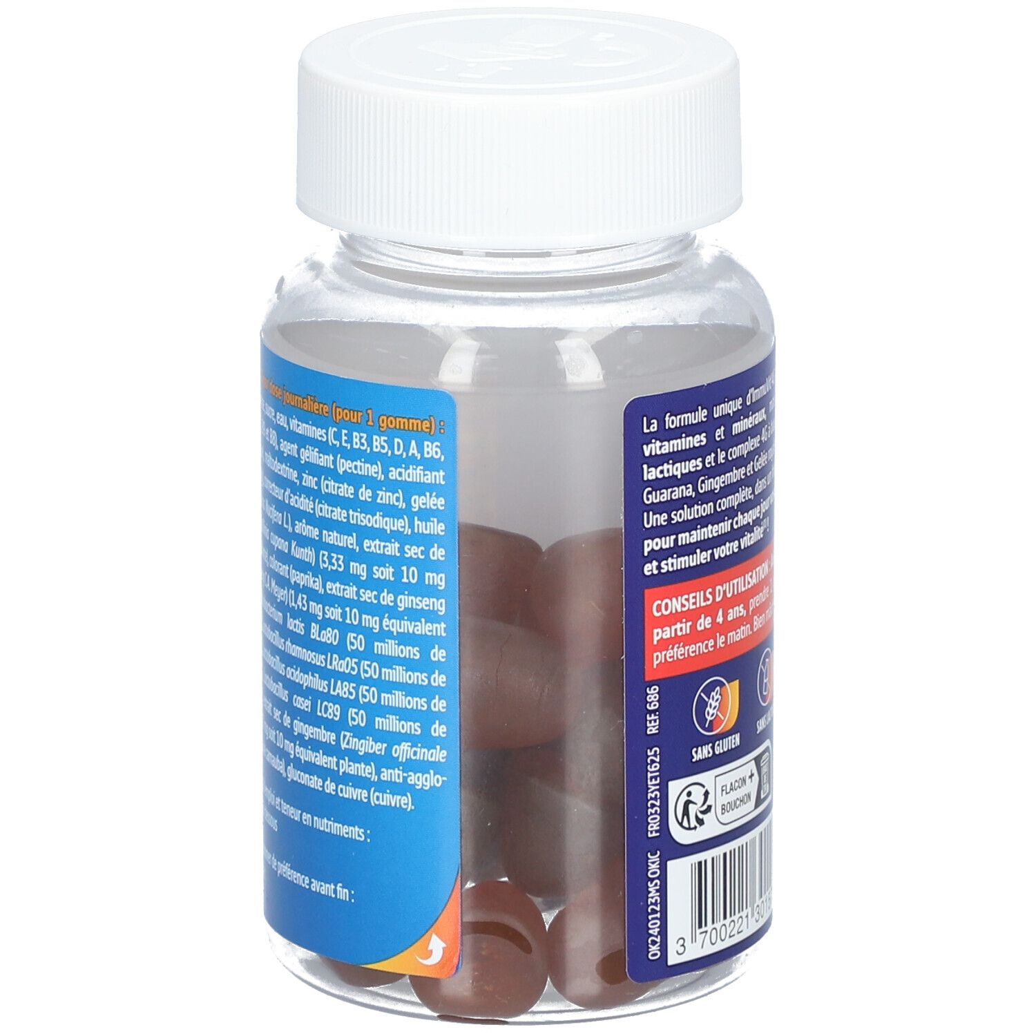 Gros plan sur le flacon. Liste des ingrédients sur l'étiquette. Gommes visibles. Contient : vitamines, minéraux, extraits.
