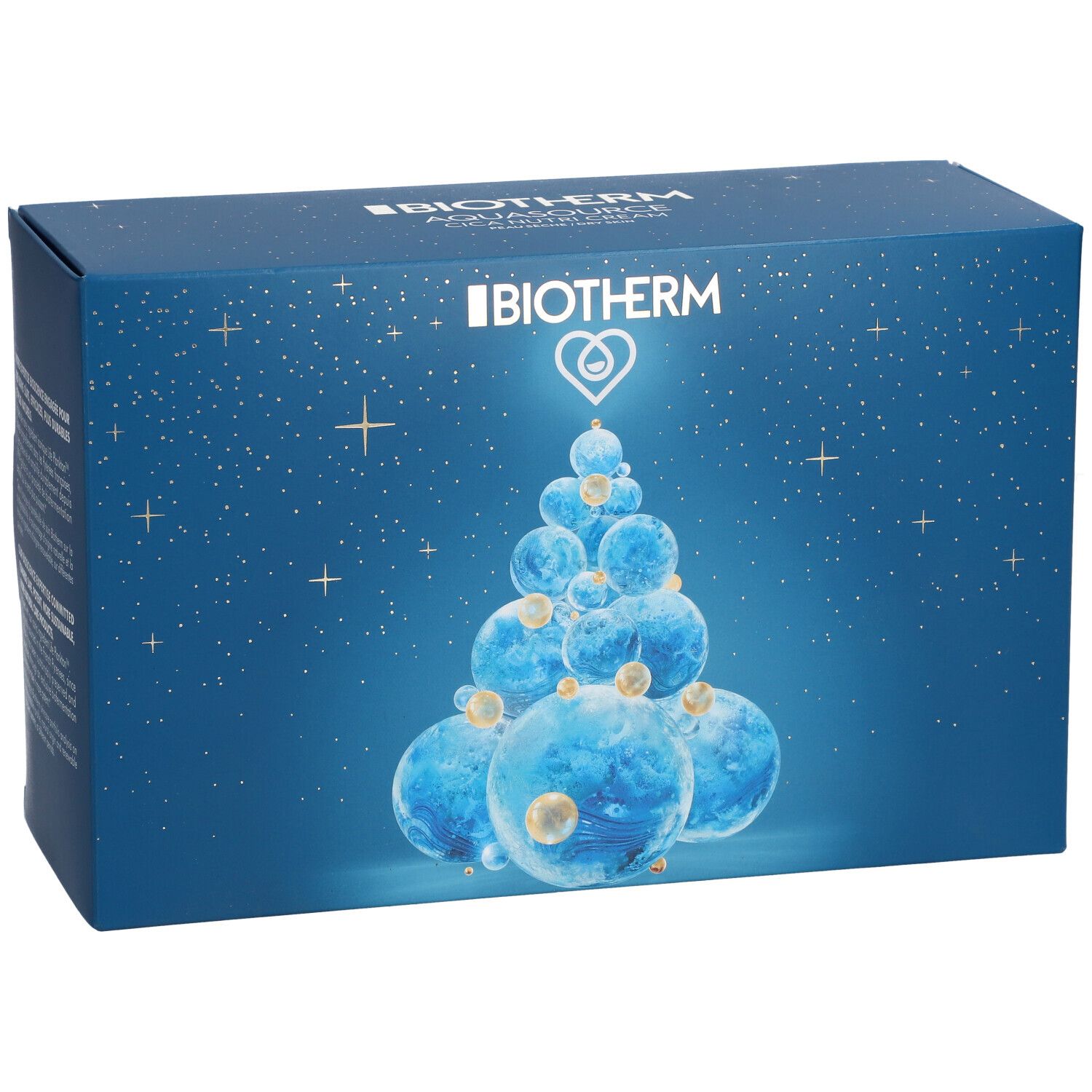 Boîte bleue avec motif sapin de Noël et logo BIOTHERM. Étoiles et détails dorés. Vue de face.