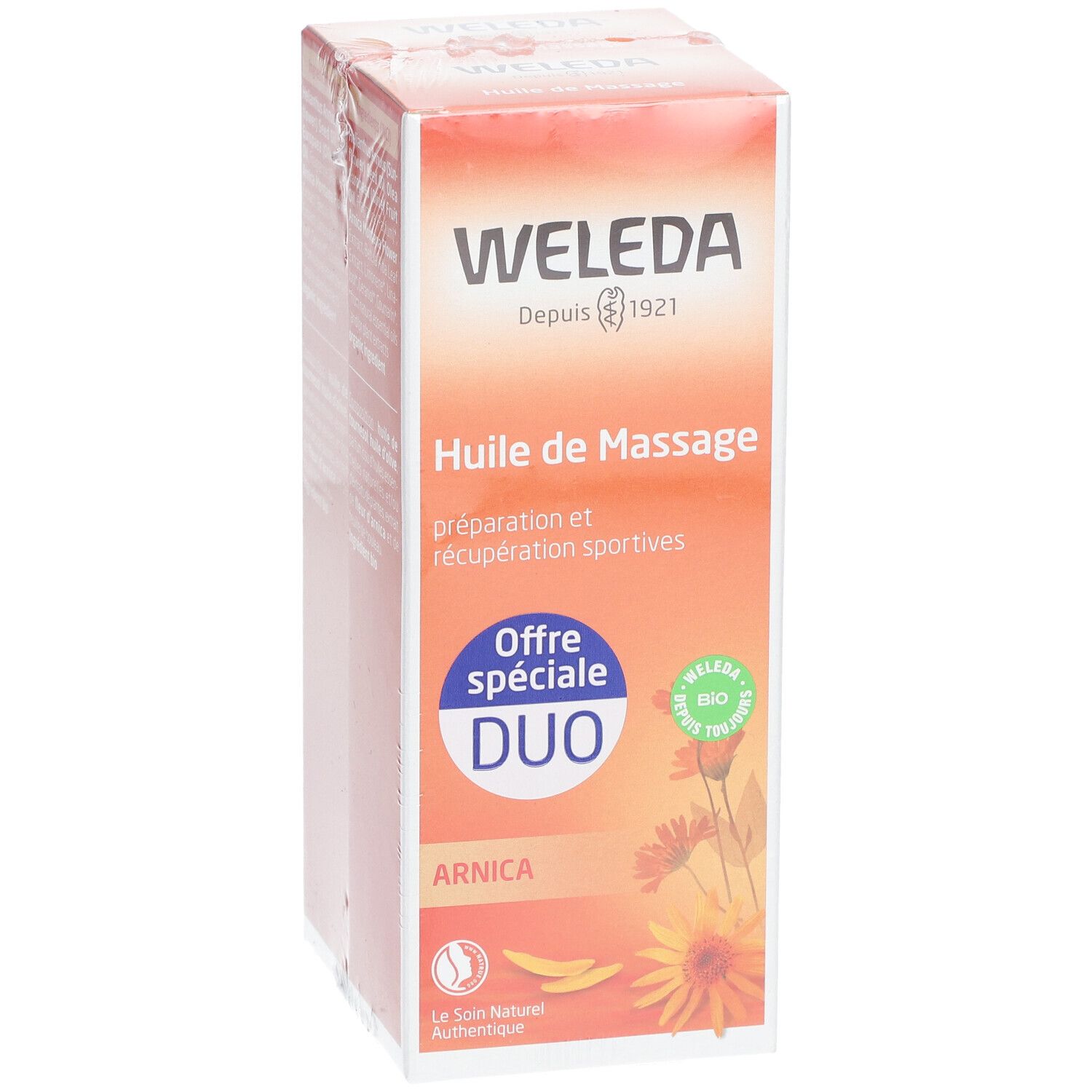 WELEDA Arnika-Massageöl DUO Verpackung. Orangefarbene Schachtel mit Produktnamen und Logo. Bio-Siegel.