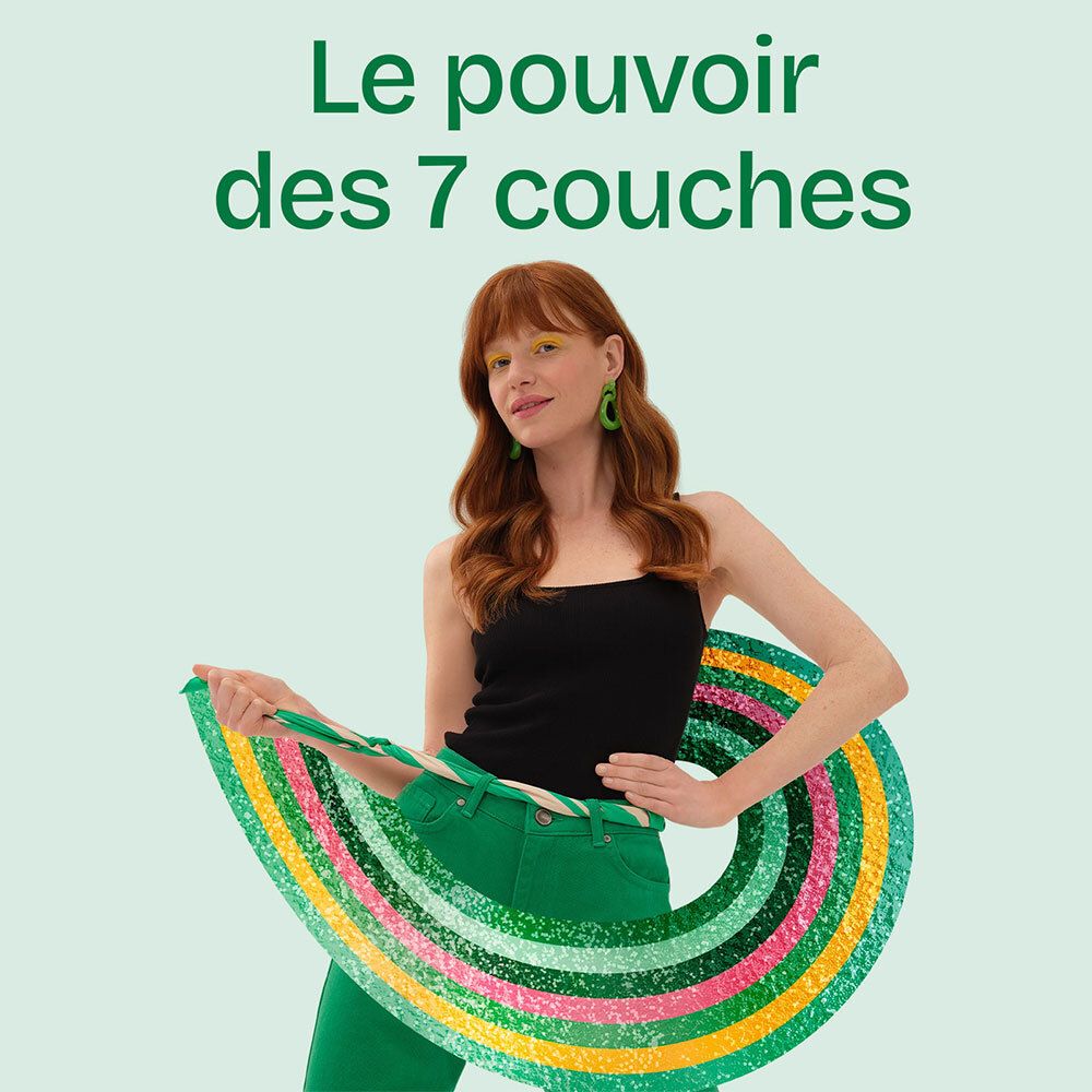 Femme avec un ruban coloré. Inscription: Le pouvoir des 7 couches. La femme porte des vêtements et des boucles d'oreilles vertes.