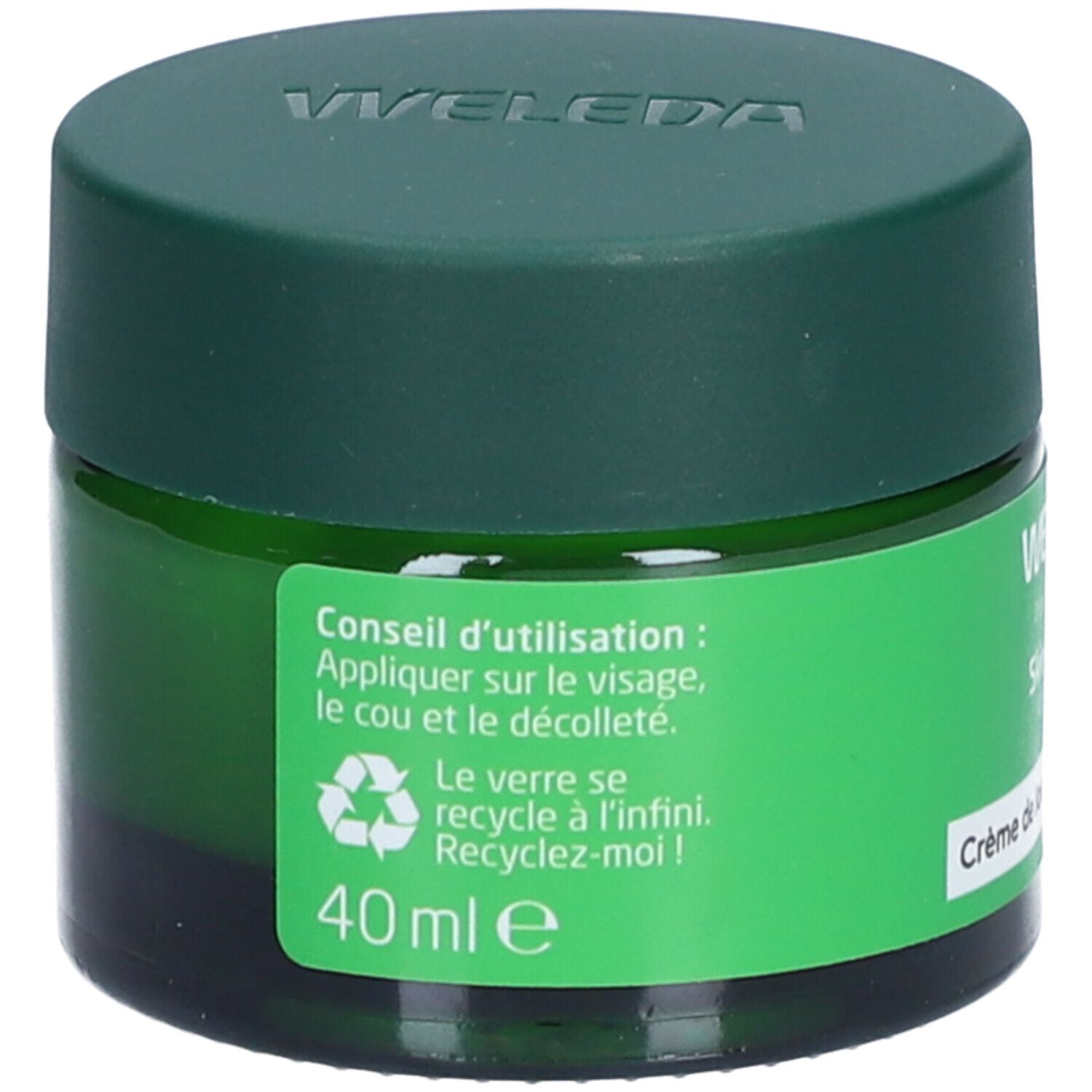 Pot vert avec couvercle vert. Inscription: Weleda. Texte sur l'utilisation et le recyclage.