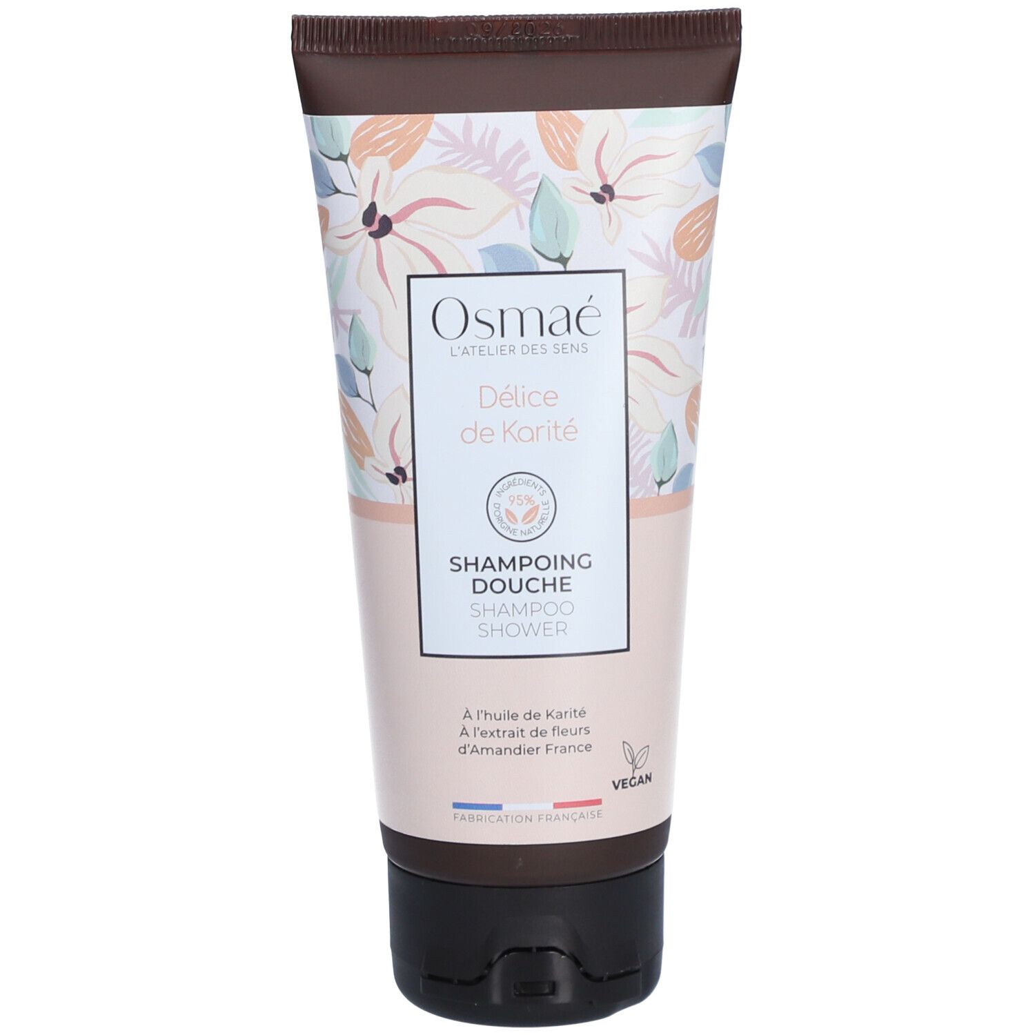 Osmaé Shampoing Douche Délice de Karité tube. Bloemenpatroon. Bruine dop. Tekst: Shampoing Douche, Vegan.