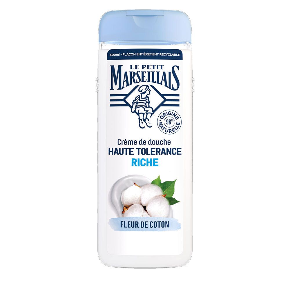 Flacon de crème de douche Le Petit Marseillais. Blanc, bouchon bleu. Visuel: fleurs de coton. Texte: Haute Tolérance Riche Fleur de Coton.
