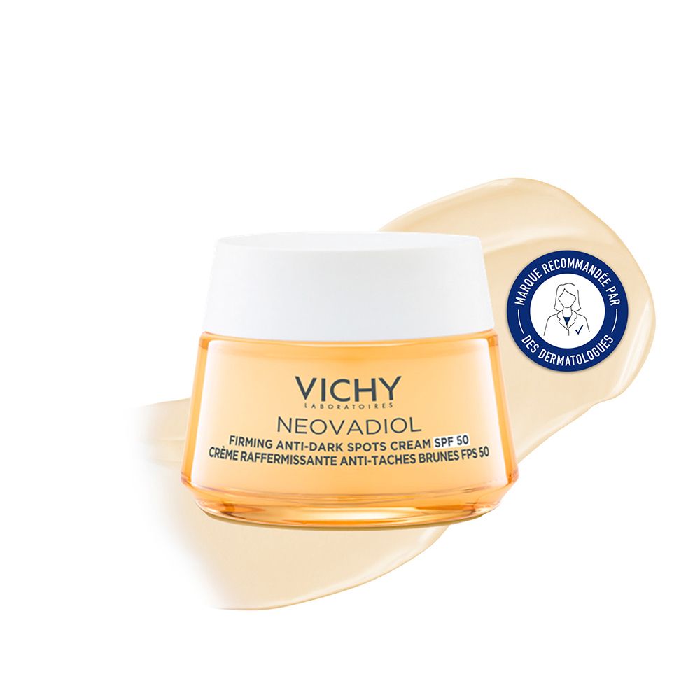 Pot de crème avec couvercle blanc. Inscription: VICHY, NEOVADIOL, Firming Anti-Dark Spots Cream SPF 50. Crème jaunâtre. Autocollant: Recommandé par les dermatologues.