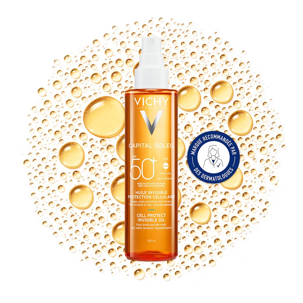 Flacon d'huile Vichy Capital Soleil. Huile orange avec vaporisateur blanc. SPF 50+ et sceau dermatologique.
