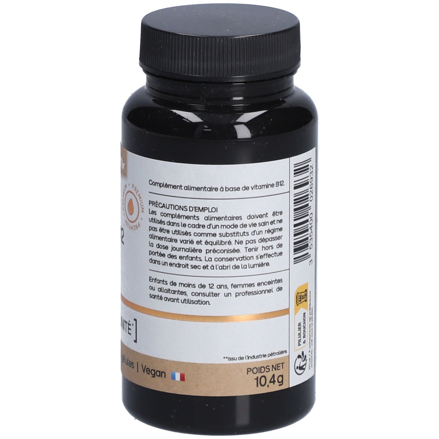 Braune Flasche mit schwarzen Deckel. Etikett mit Inhaltsangaben und Warnhinweisen. Vegan.