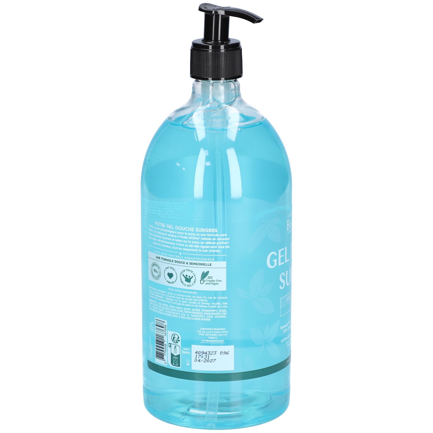 Dos d'un flacon transparent de gel douche bleu. Distributeur noir. Texte et logos sur l'étiquette.