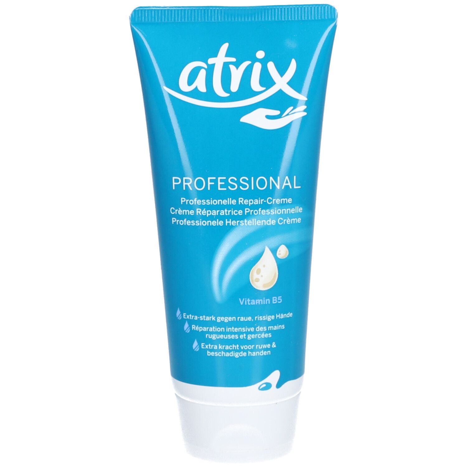 Tube bleu avec bouchon blanc. Inscription: atrix PROFESSIONAL Repair-Crème. Contient de la vitamine B5. Texte en allemand, français, néerlandais.