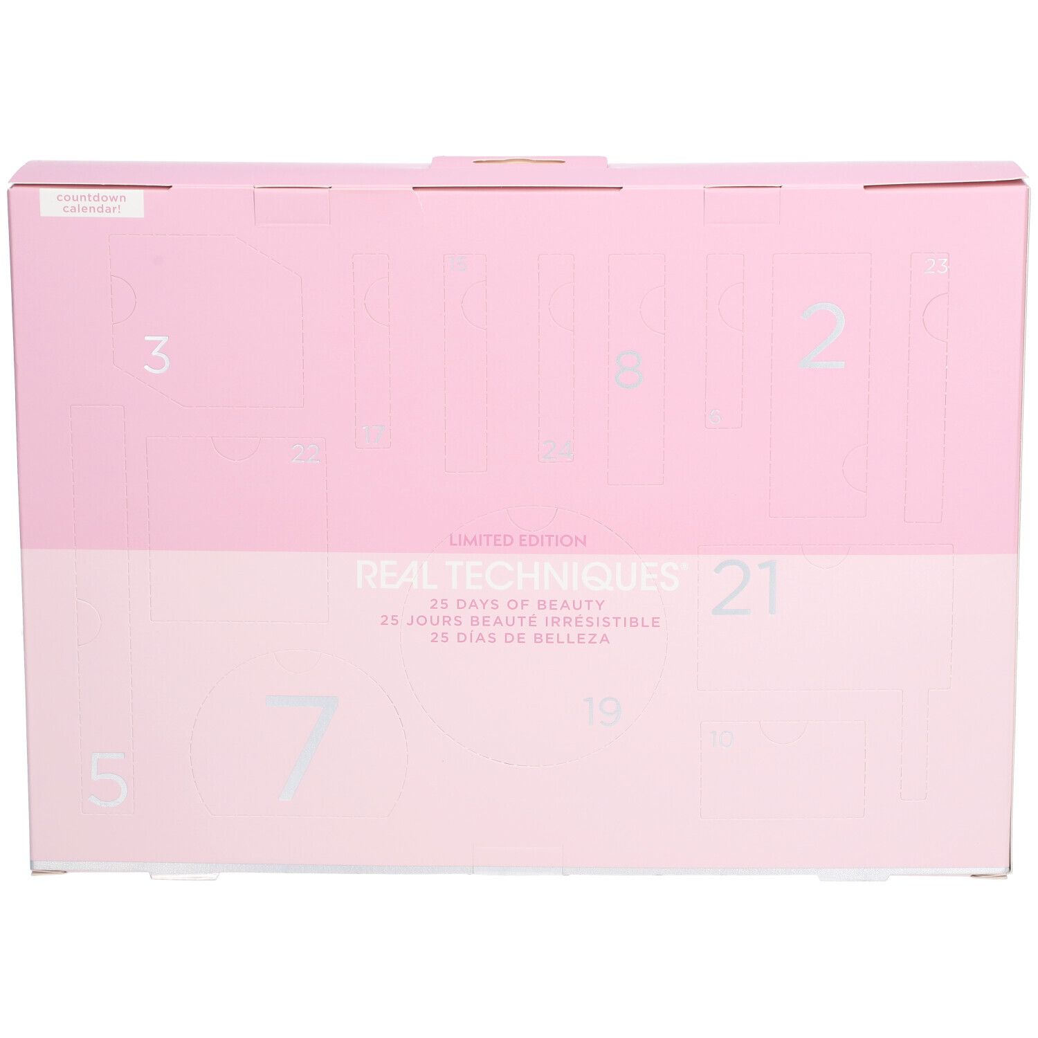 Rosa Adventskalender-Box mit silbernen Zahlen. "REAL TECHNIQUES" und "25 Tage Schönheit" Text.