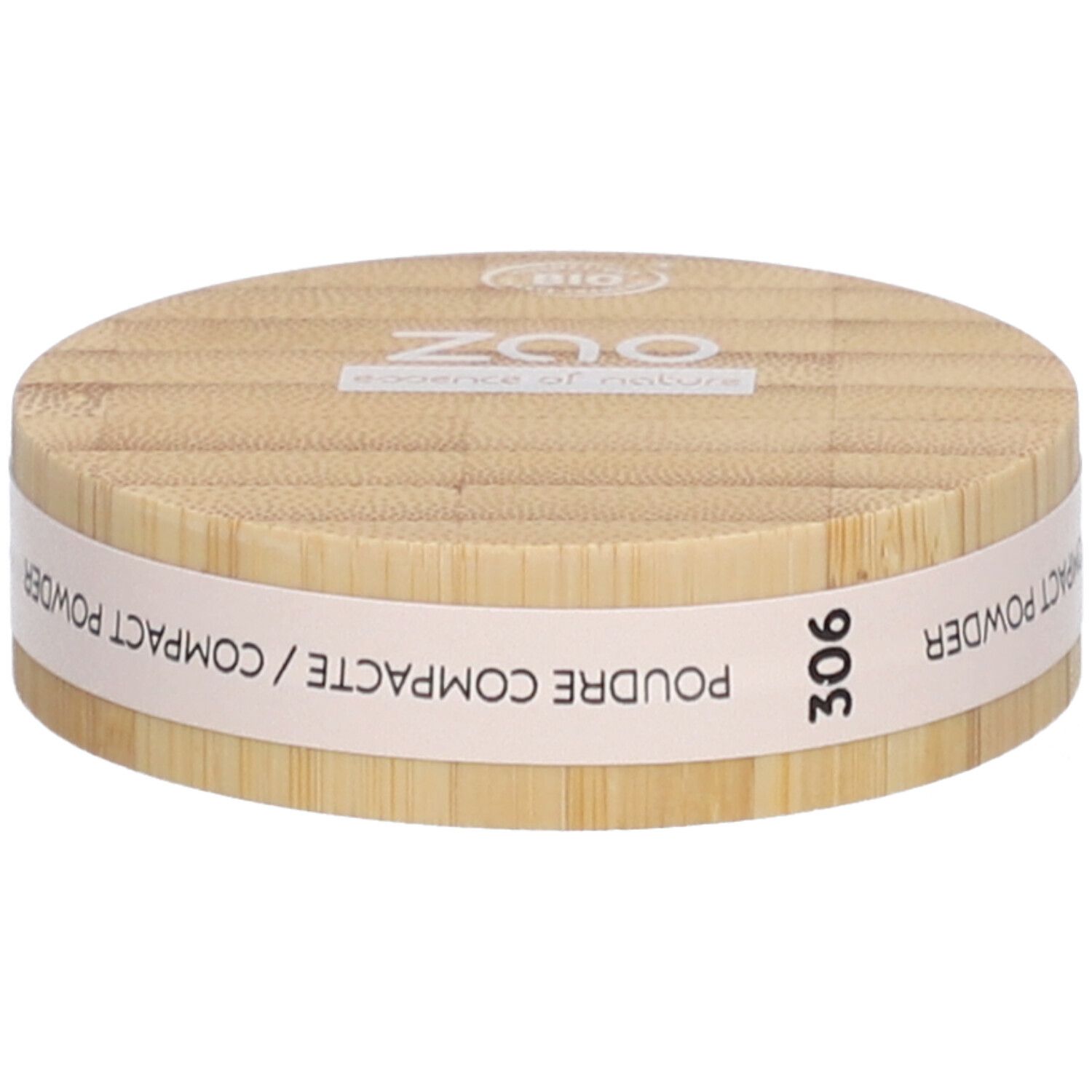 Ronde compactpoederdoos van hout. Opschrift: ZAO, essence of nature, 306, Poudre Compacte / Compact Powder.