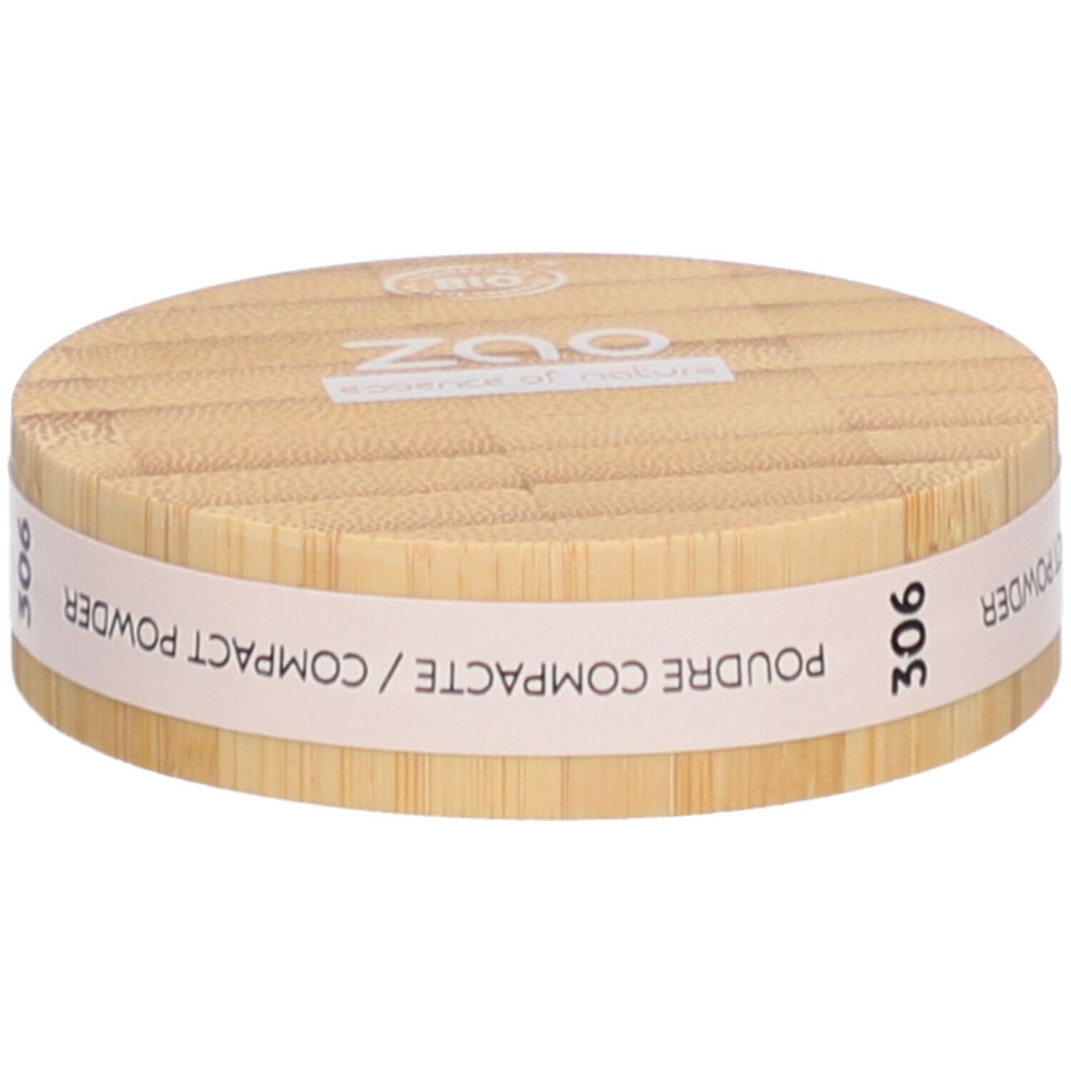 Ronde compactpoederdoos van hout. Opschrift: ZAO, essence of nature, 306, Poudre Compacte / Compact Powder.