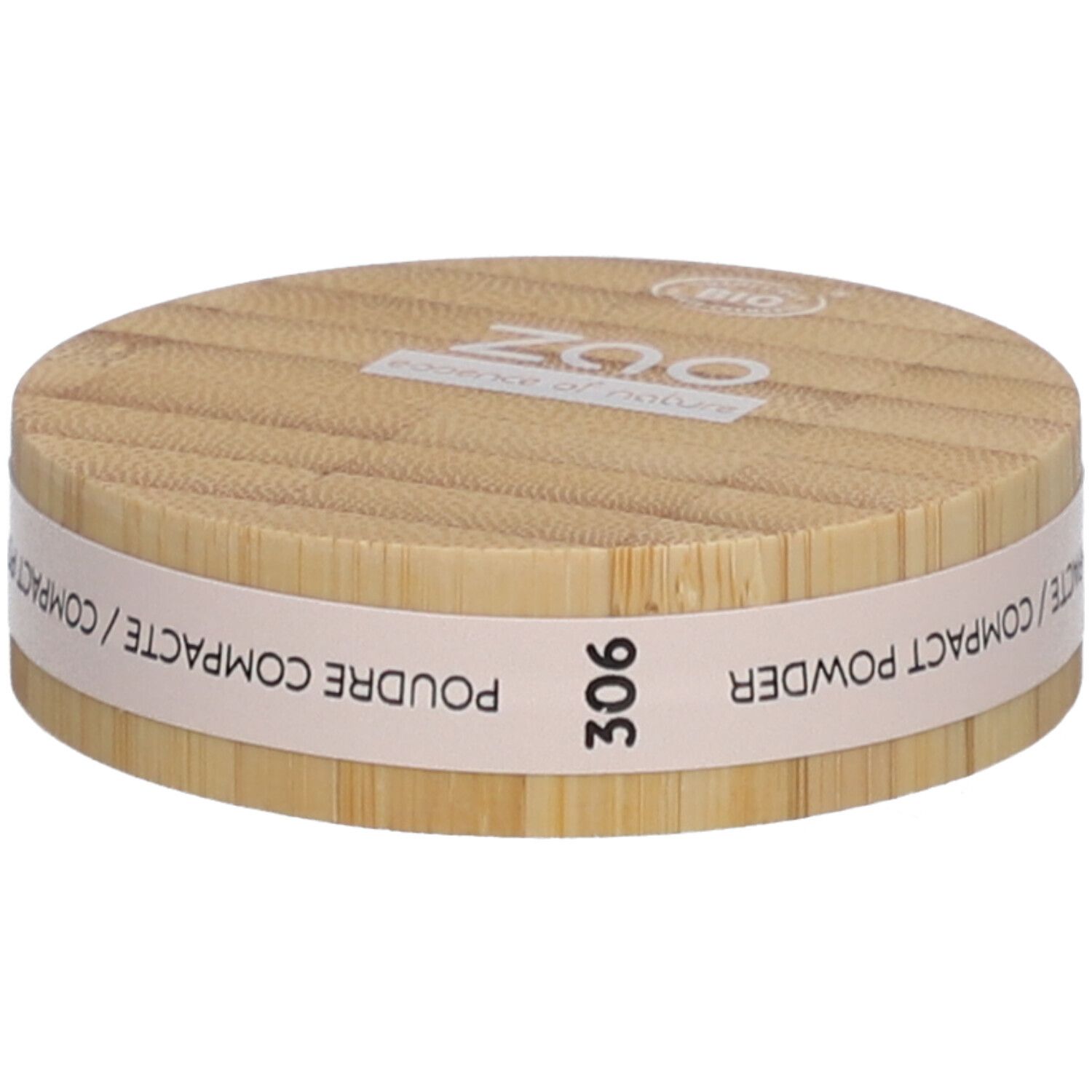Ronde compactpoederdoos van hout. Opschrift: ZAO, essence of nature, 306, Poudre Compacte / Compact Powder.