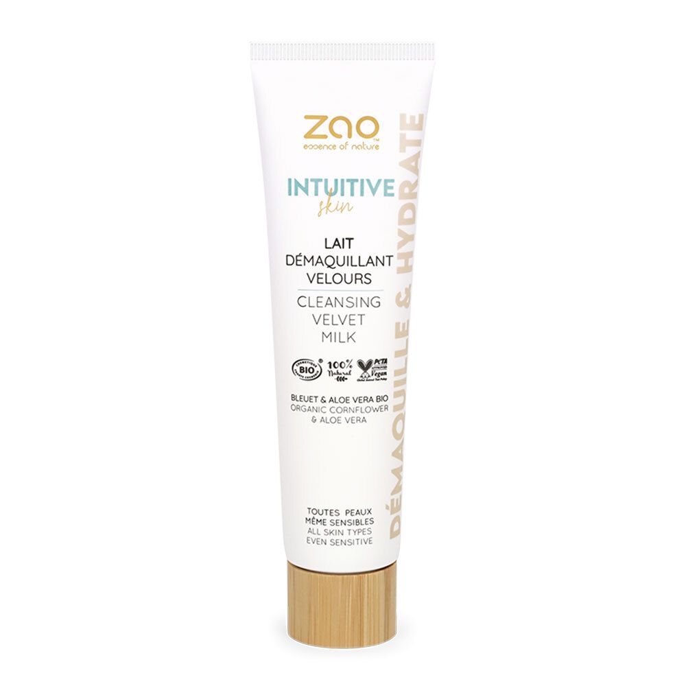Witte tube met productnaam en logo. Houtkleurige dop. Tekst: Lait Démaquillant Velours, Intuitive Skin, Demaquille & Hydrate.
