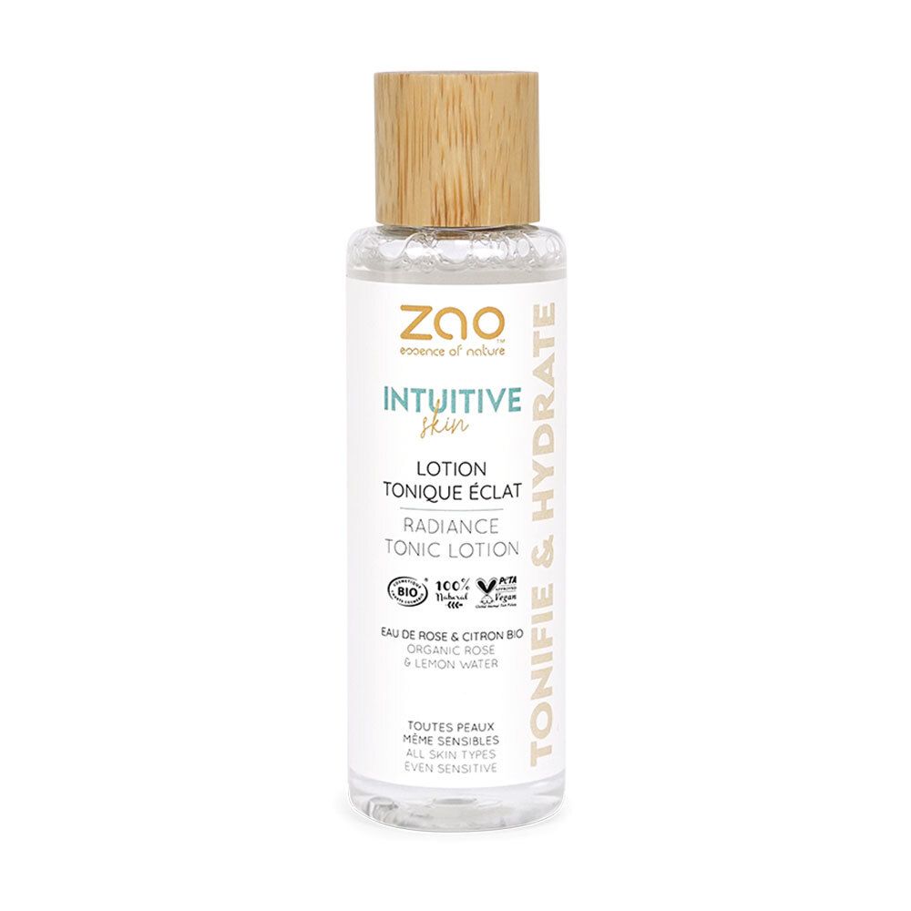 Transparante fles met houten dop. Opschrift: Intuitive Skin, Lotion Tonique Eclat, Radiance Tonic Lotion. Bio-certificering.