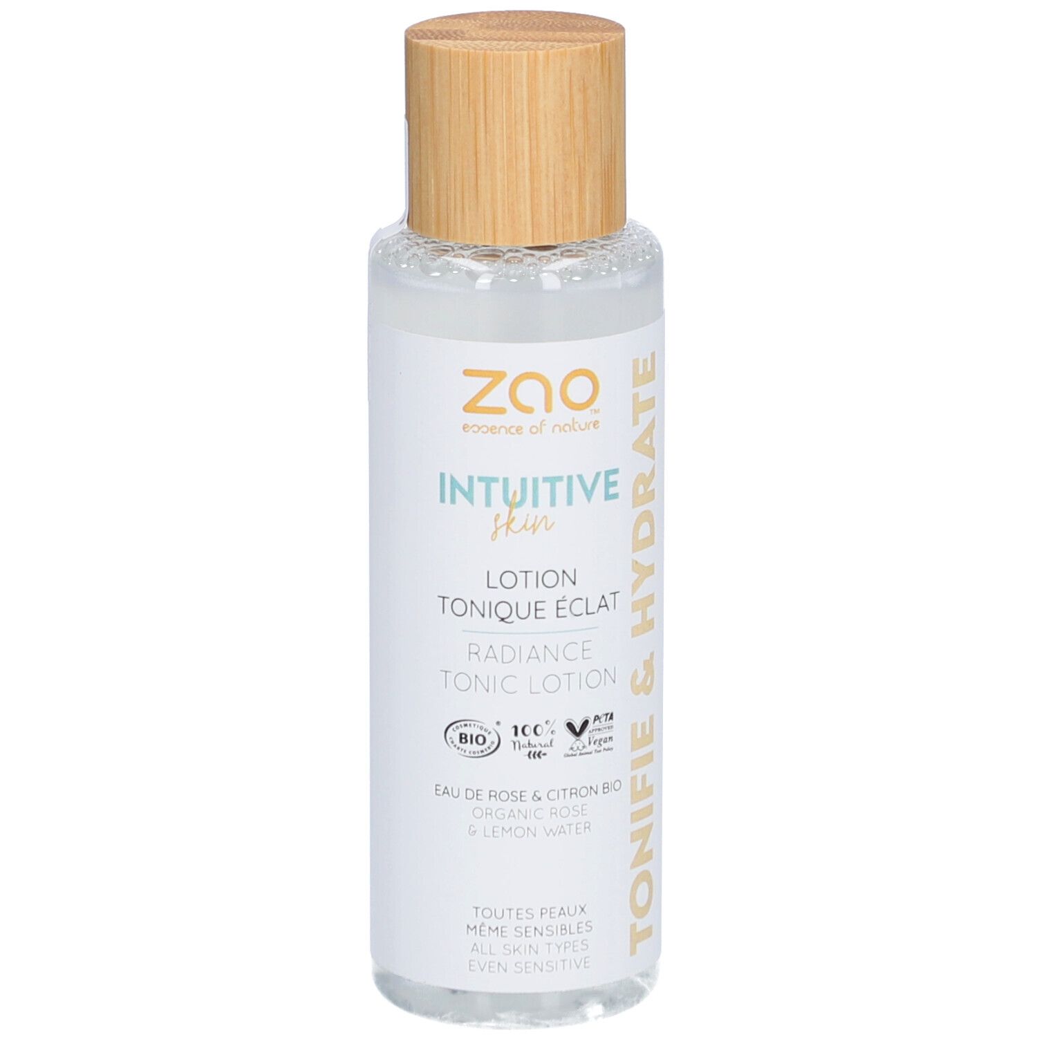 Transparante fles met houten dop. Opschrift: Intuitive Skin, Lotion Tonique Eclat, Radiance Tonic Lotion. Bio-certificering.