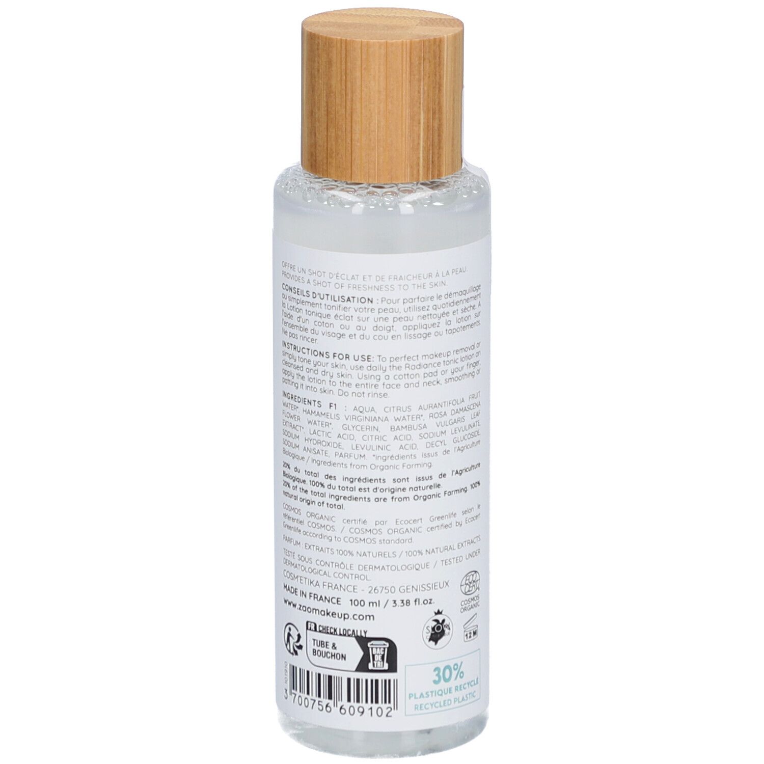 Transparante fles met houten dop. Achterkant met ingrediënten en gebruiksaanwijzing. Bio-certificering.